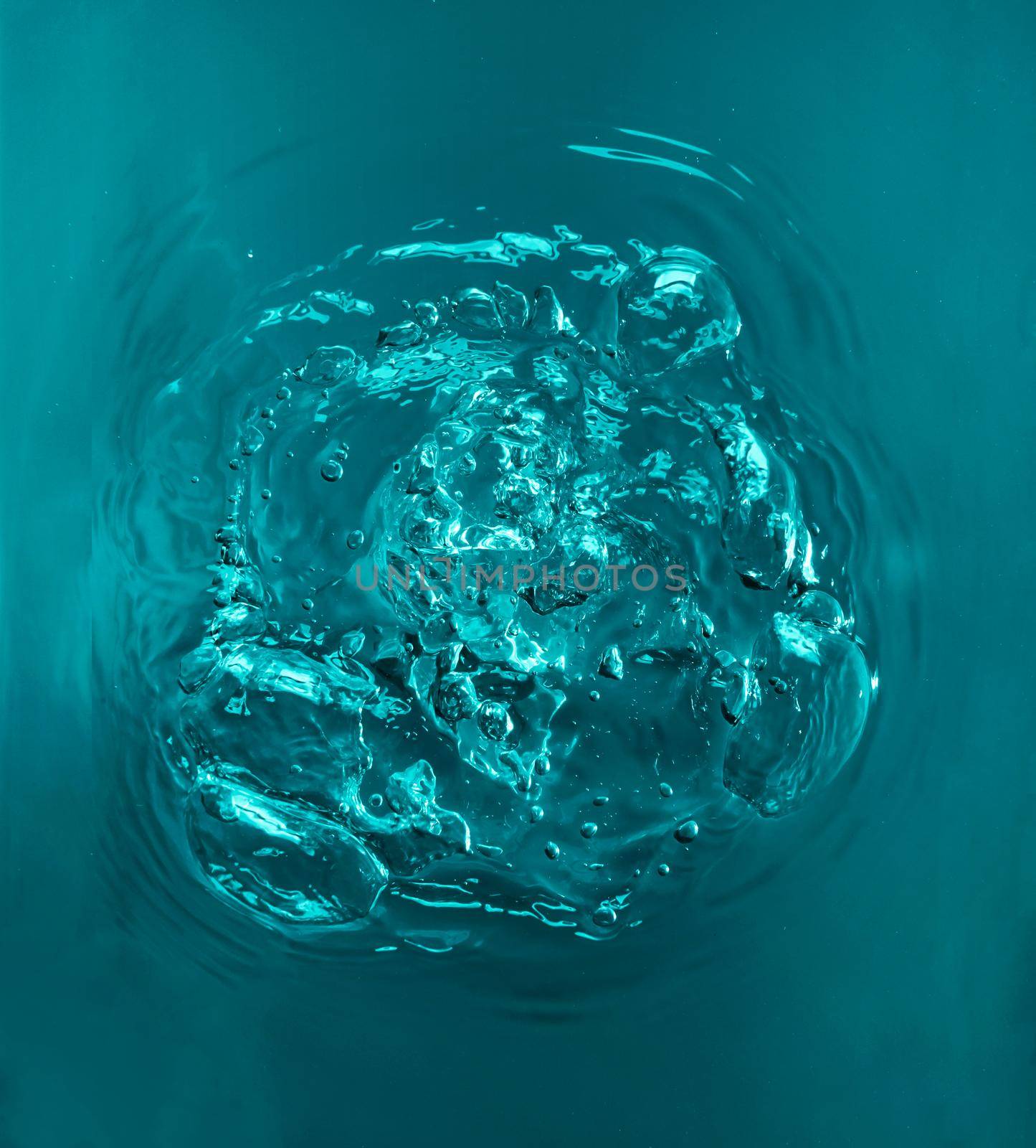 Air bubbles in turquoise color water, top view