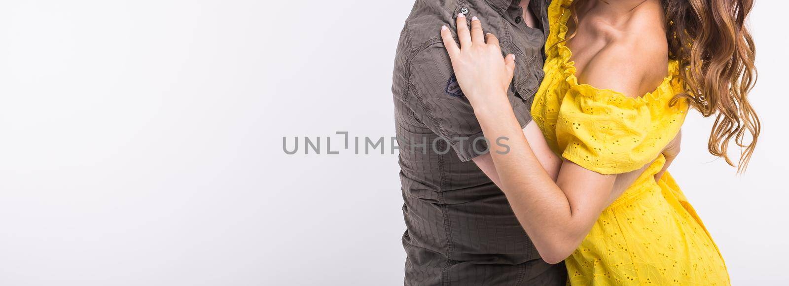 Couple dancing latin music. Bachata, merengue, salsa and kizomba. Close-up of elegance pose on white background with copy space. by Satura86