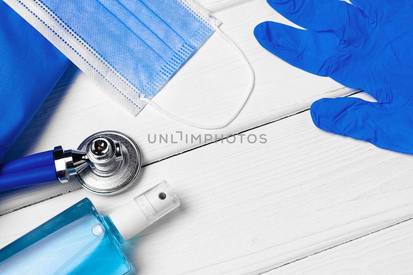 Doctors uniform with mask, stethoscope and other tools close up