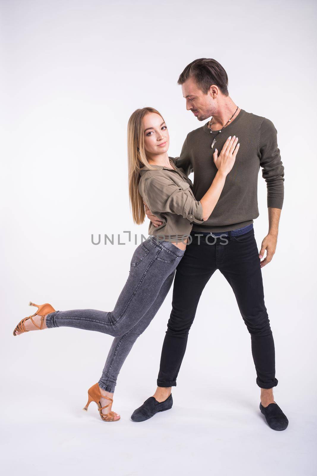 Salsa, kizomba and bachata dancers on white background. Social dance.