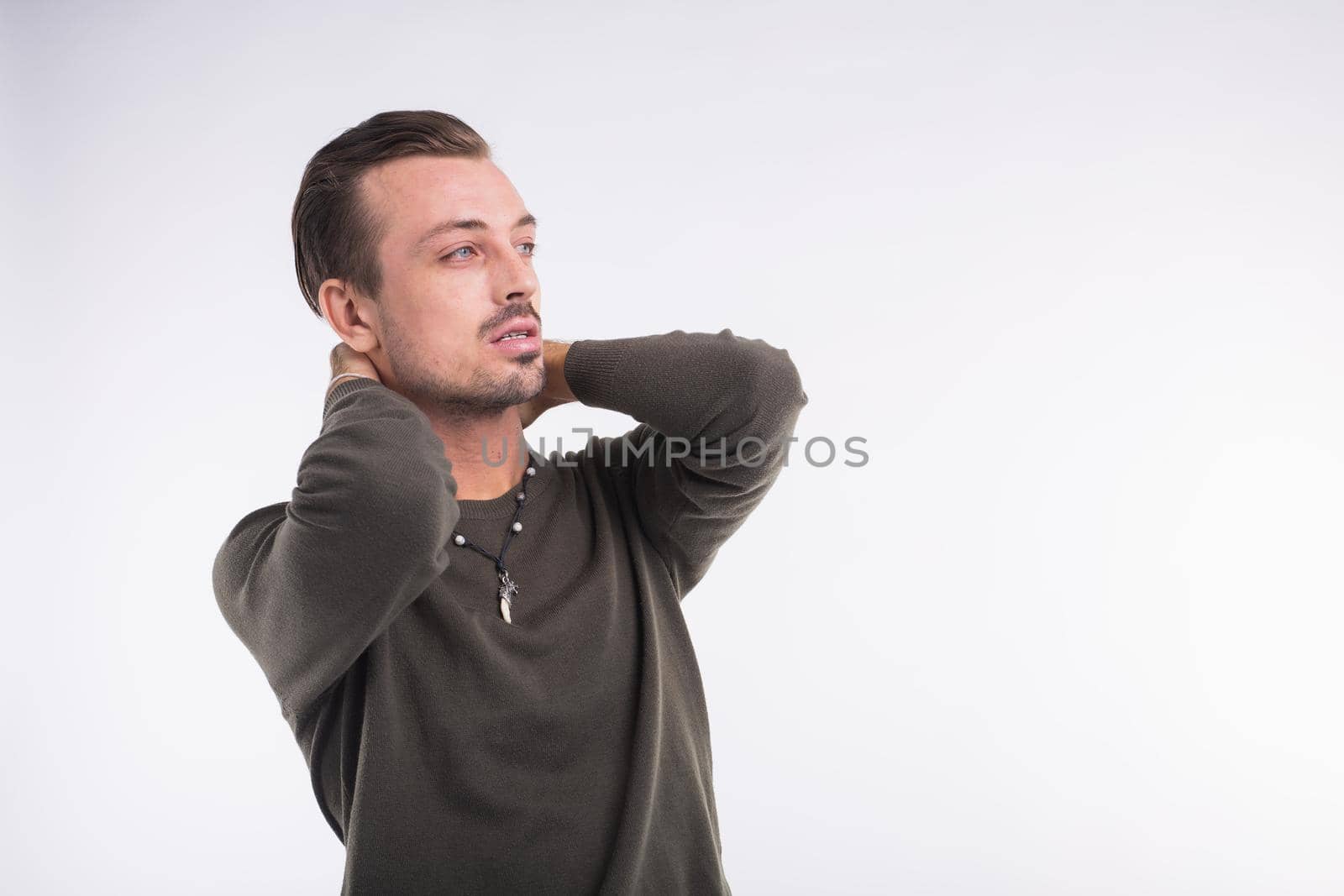 Elegant young handsome man. Studio fashion portrait. White background with copy space. by Satura86