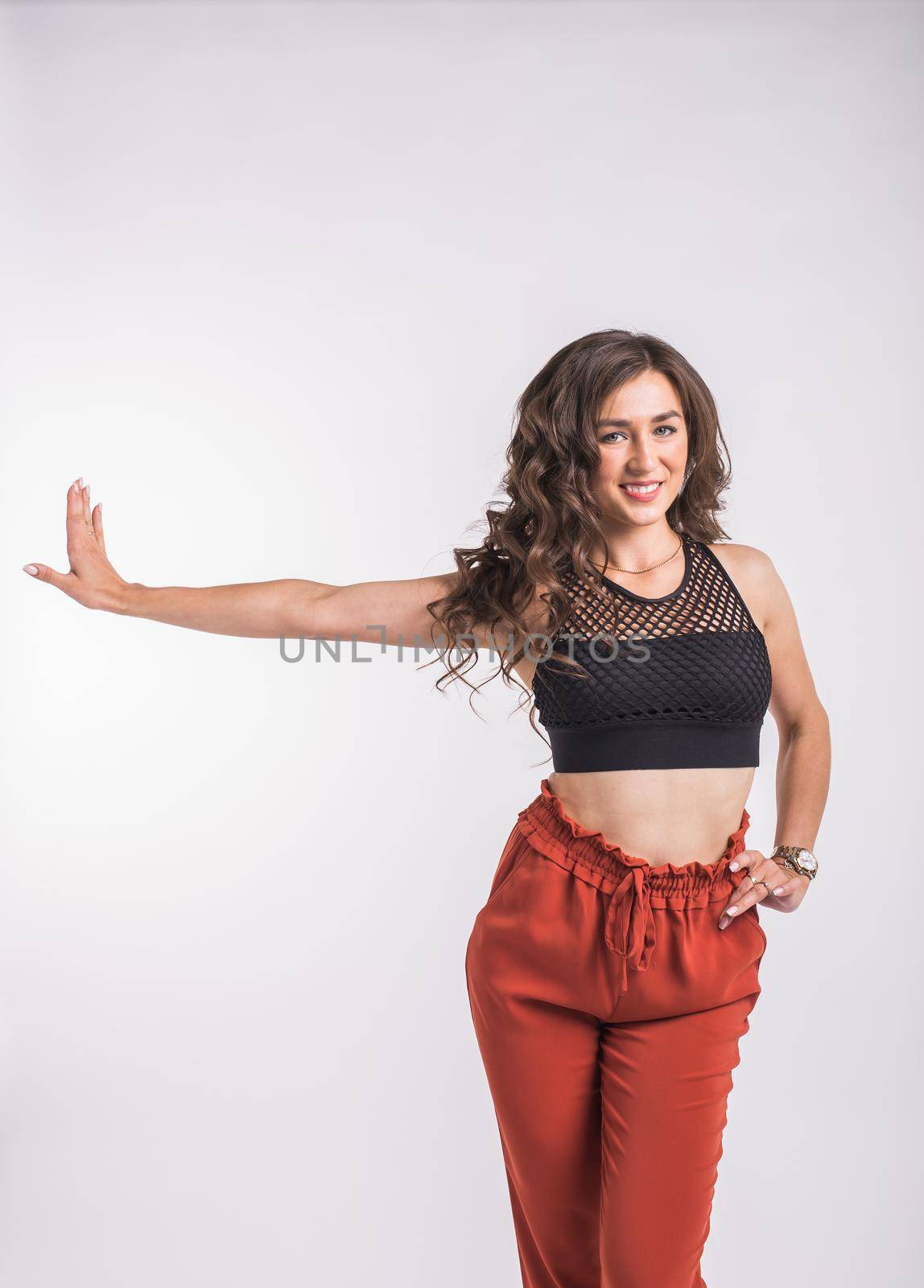 Latina dance, strip dance, contemporary and bachata lady concept - Woman dancing improvisation and moving her long hair on a white background