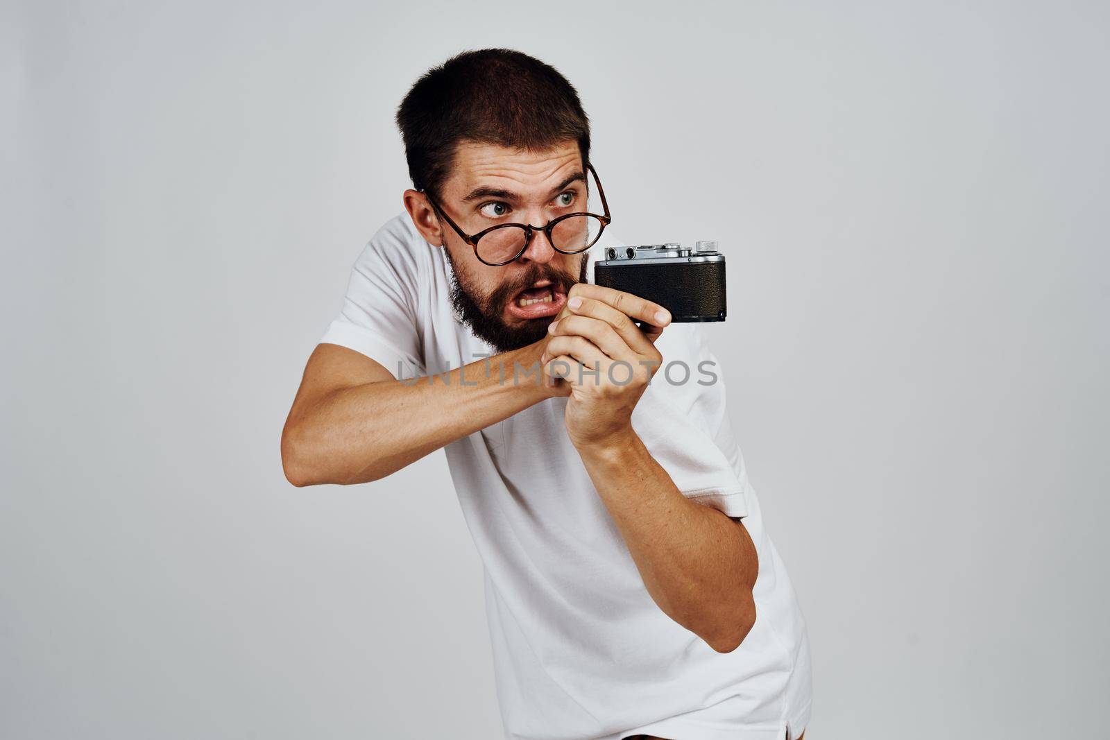 male photographer in glasses with a camera professionals modern style by Vichizh