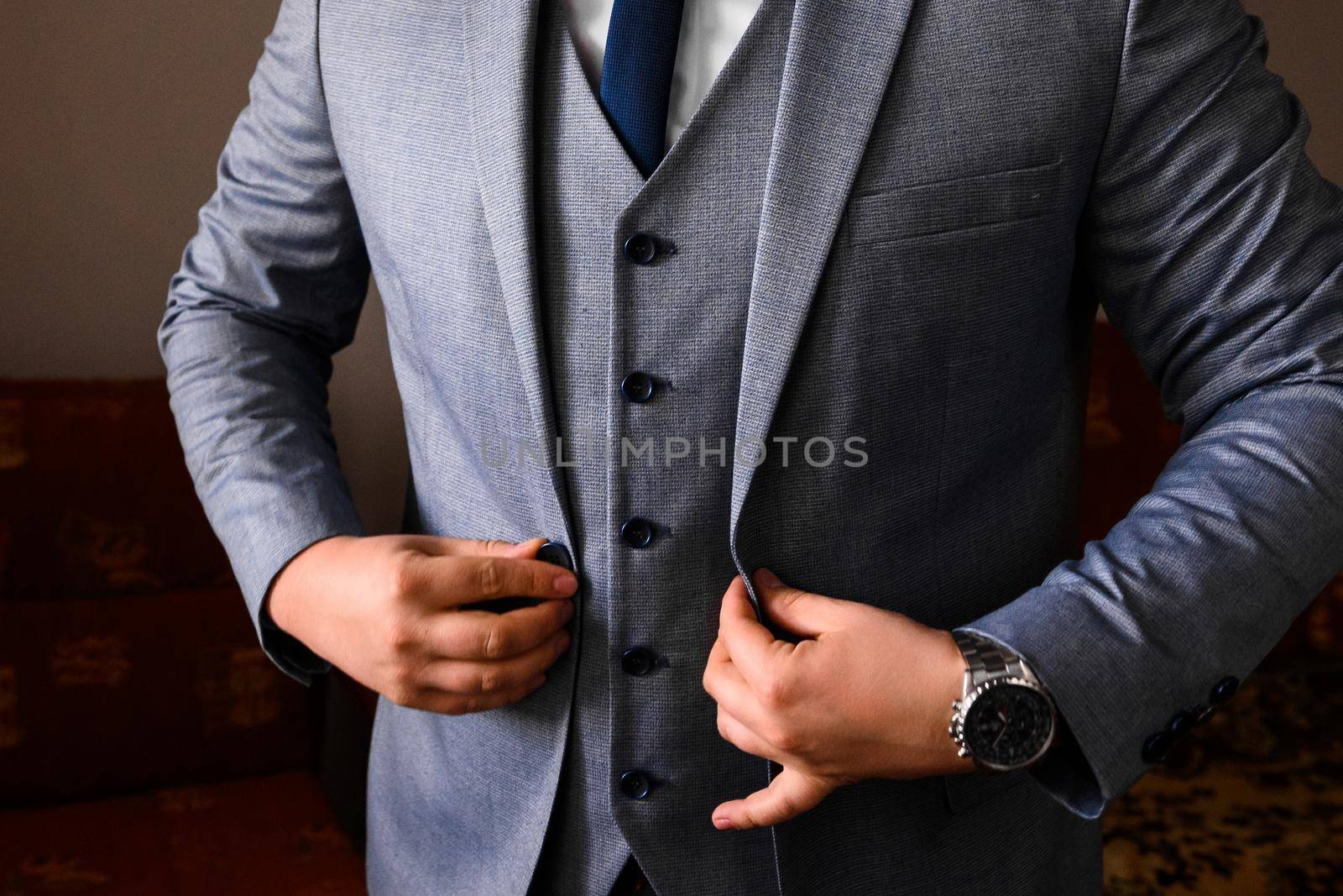 male hands close up, the groom is preparing in the morning before the wedding ceremony.2020