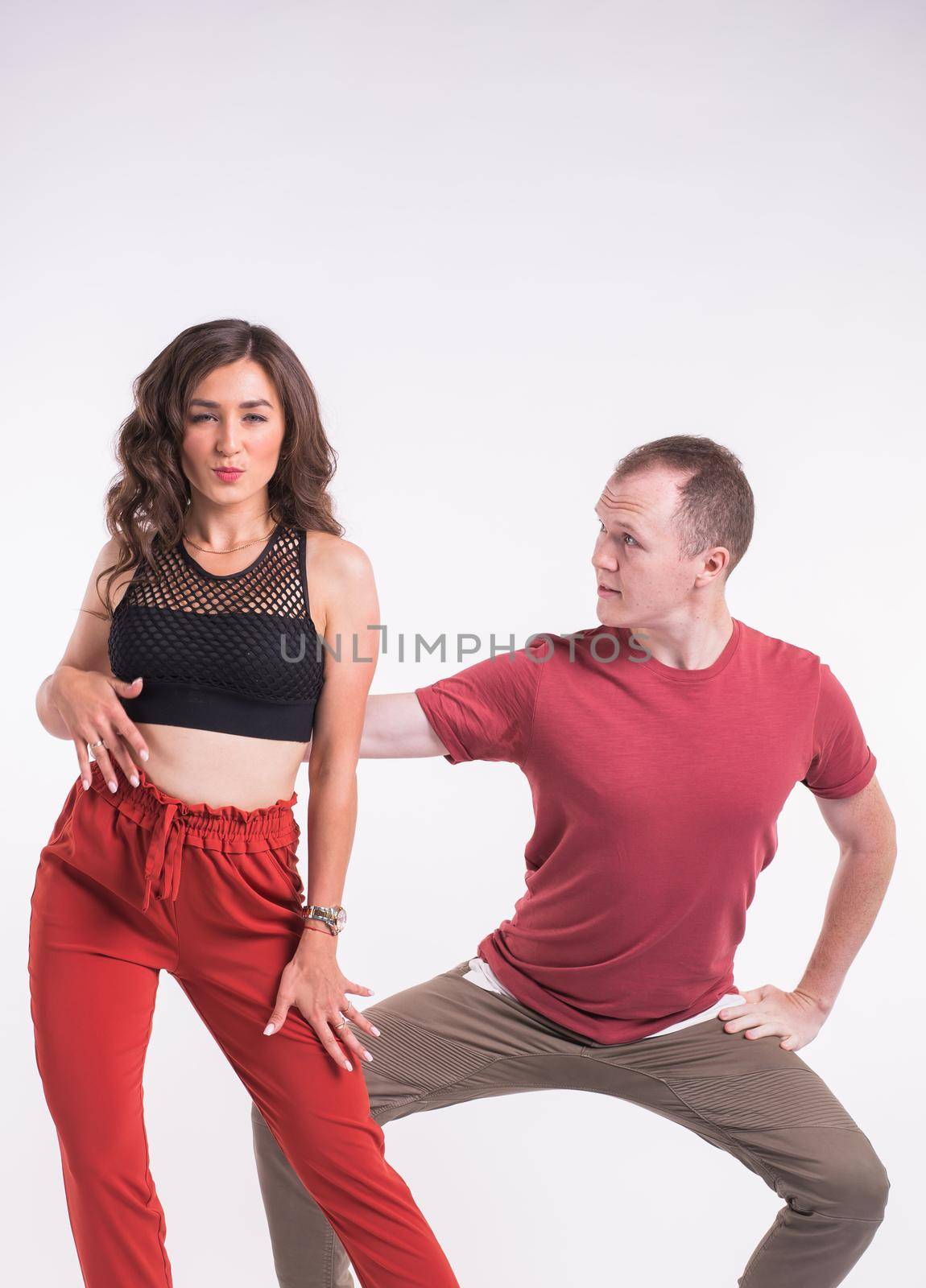 Beauty couple dancing social dance. Kizomba or bachata or semba or taraxia , on white background. Social dance concept. by Satura86