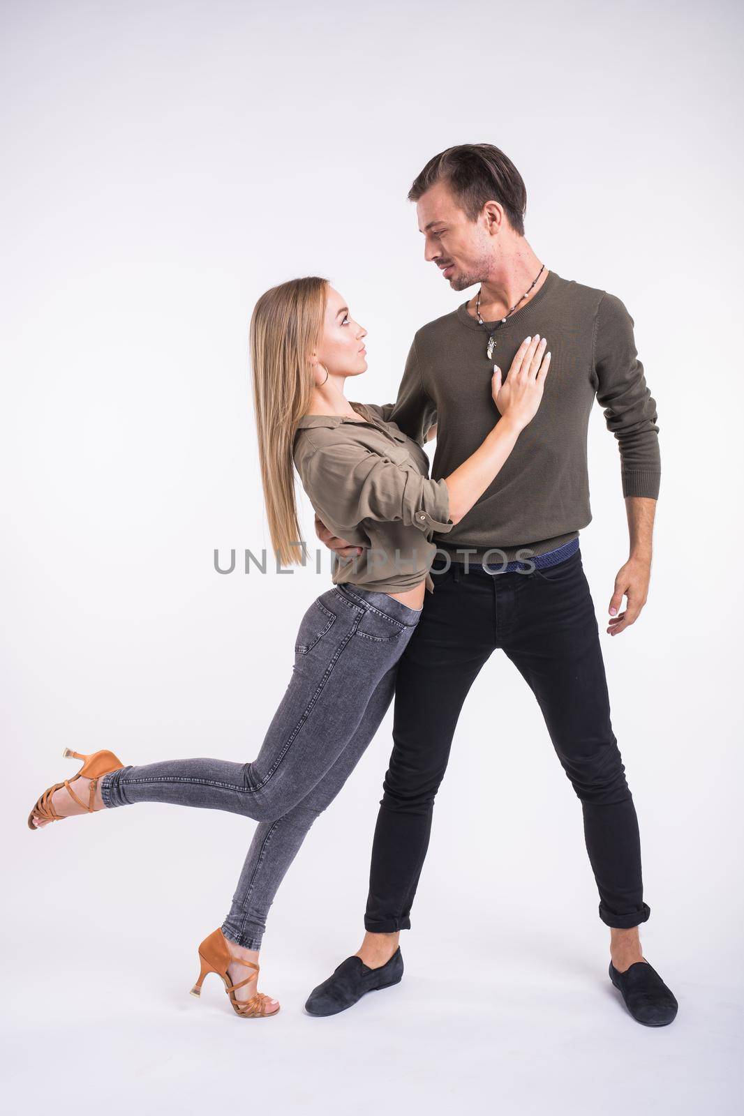 Salsa, kizomba and bachata dancers on white background. Social dance.