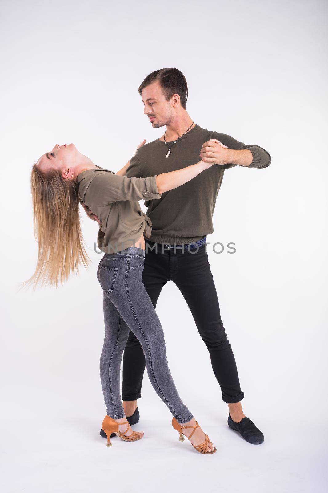 Salsa, kizomba and bachata dancers on white background. Social dance.