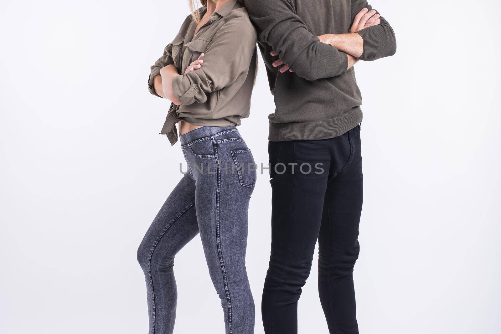 Close-up of couple woman and man standing back to back. They look very sad, disappointed with each other, isolated on white background. Marriage, relationship problems. Human emotions, expressions by Satura86