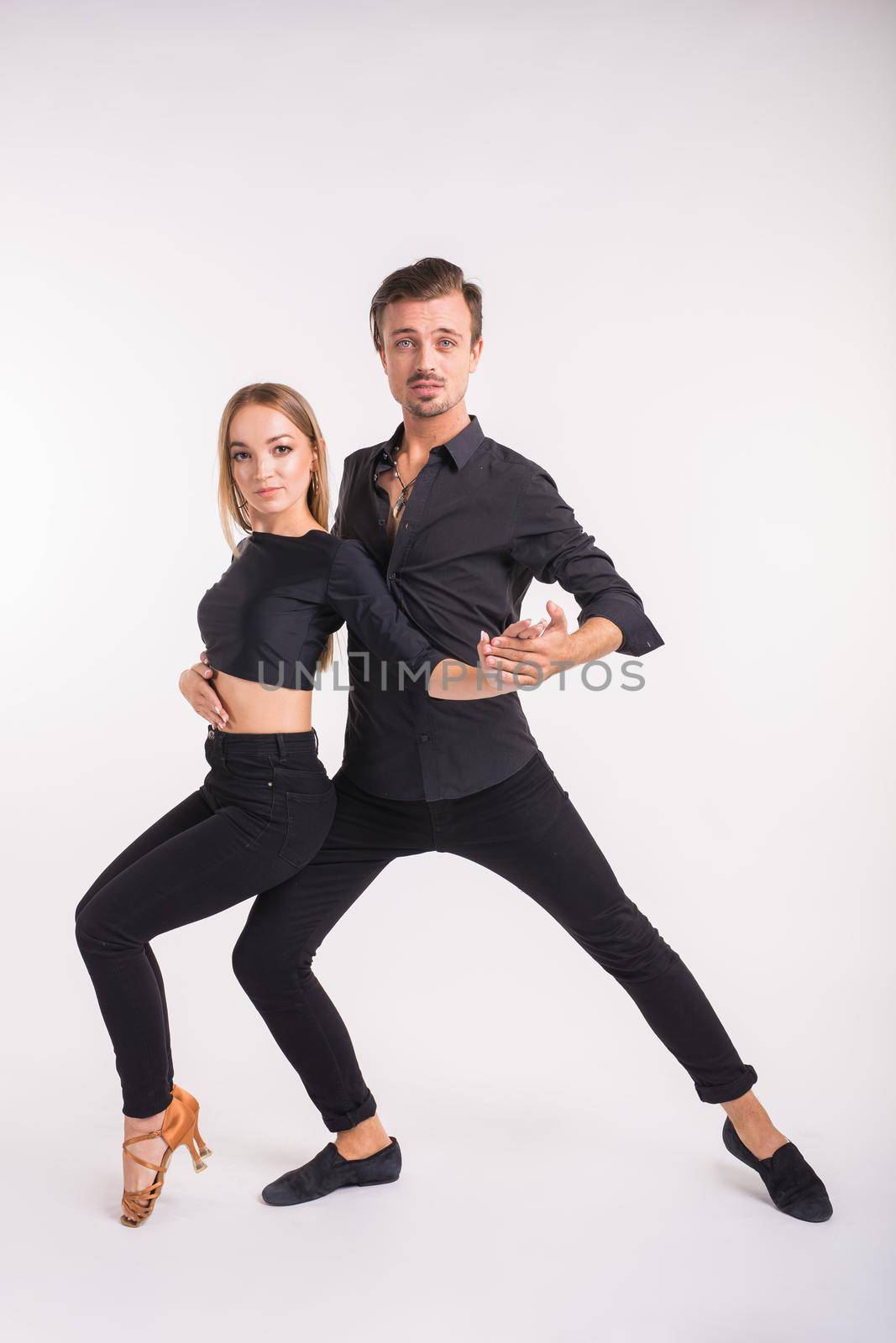 Beauty couple dancing social dance. Kizomba or bachata or semba or taraxia , on white background.