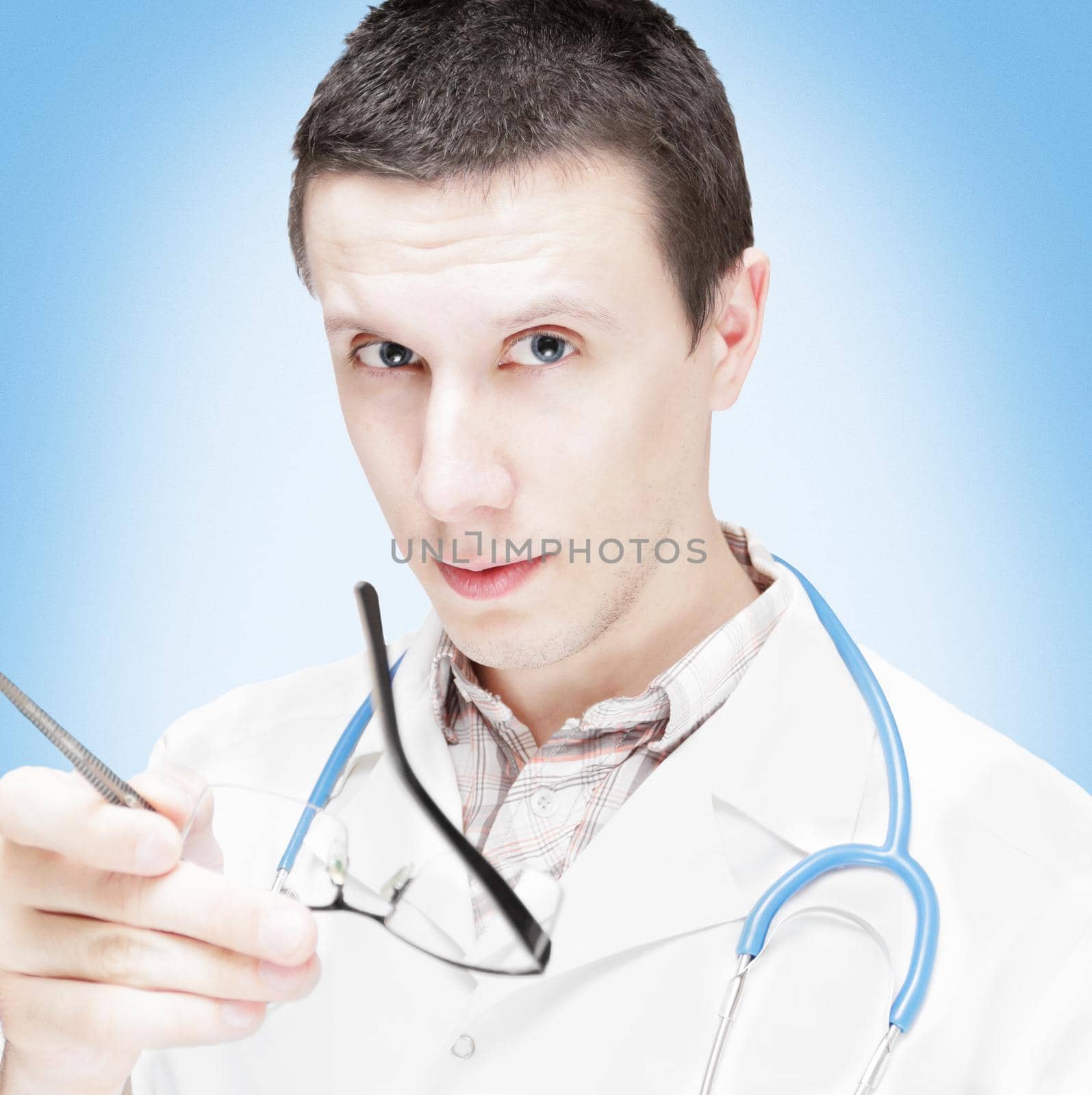The serious doctor. It is isolated on a white background