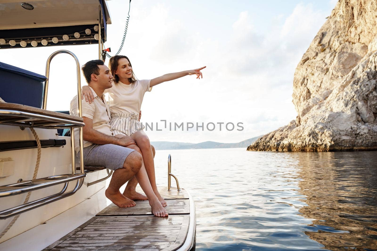 Loving couple spending time on a yacht at the open sea