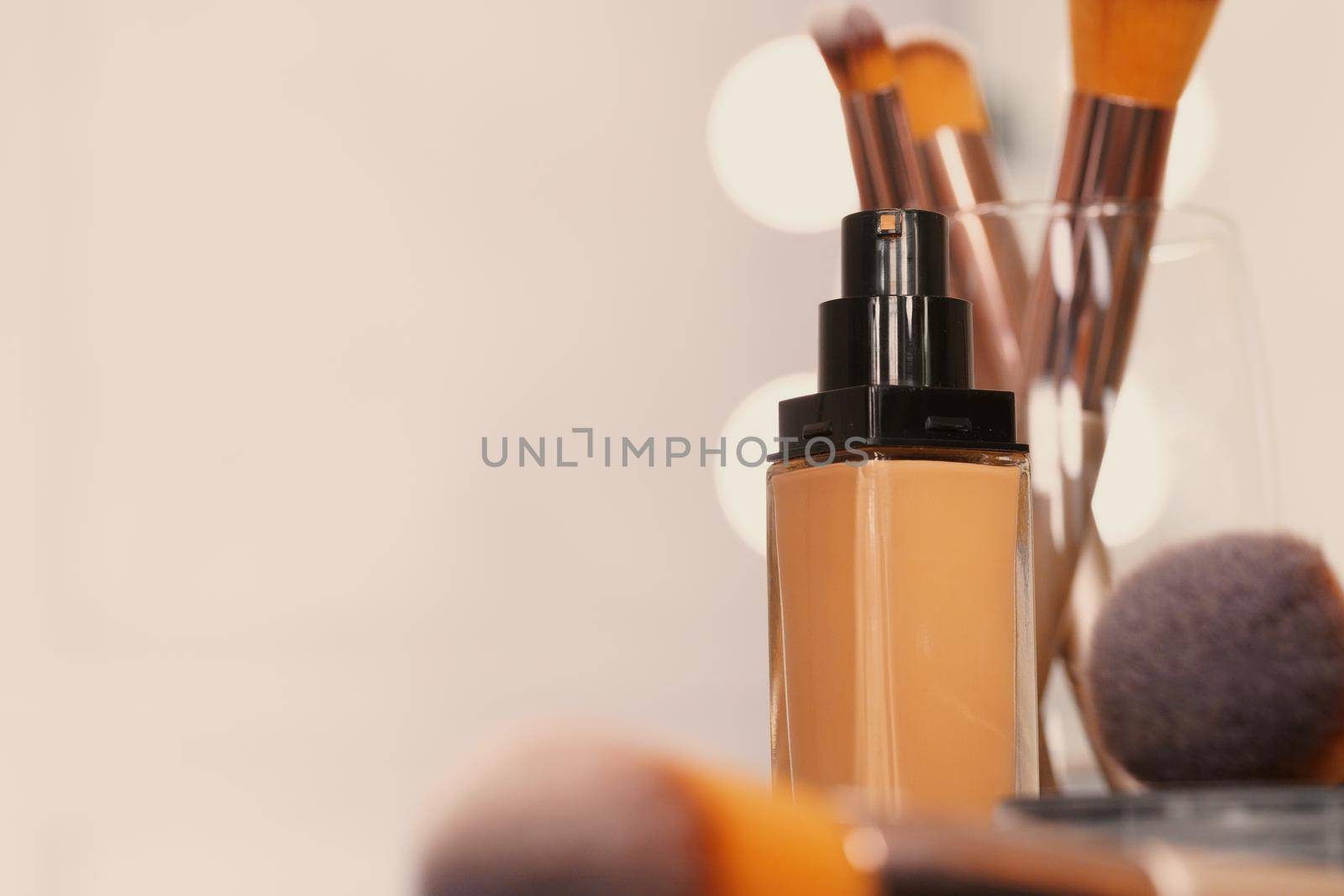 Decorative cosmetics and tools on dressing table in makeup room, close up