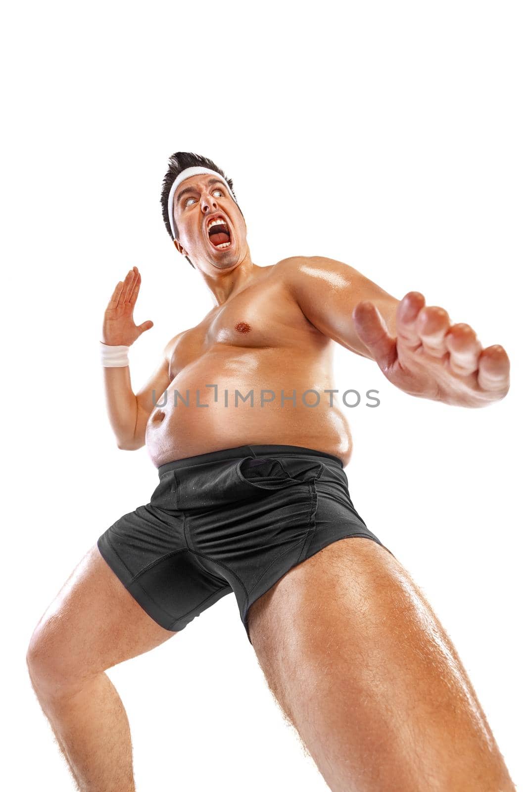 Fat man doing karate workout traning. Guy isolated over white background