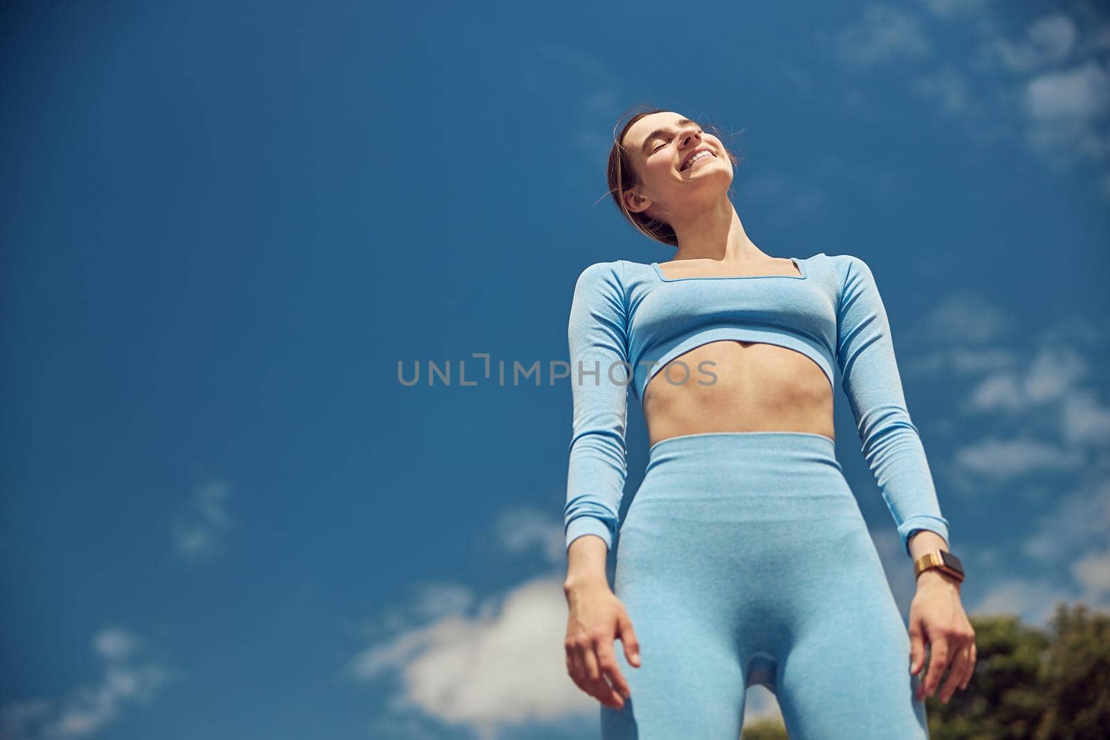 Beautiful fit young woman jogger is running outdoors