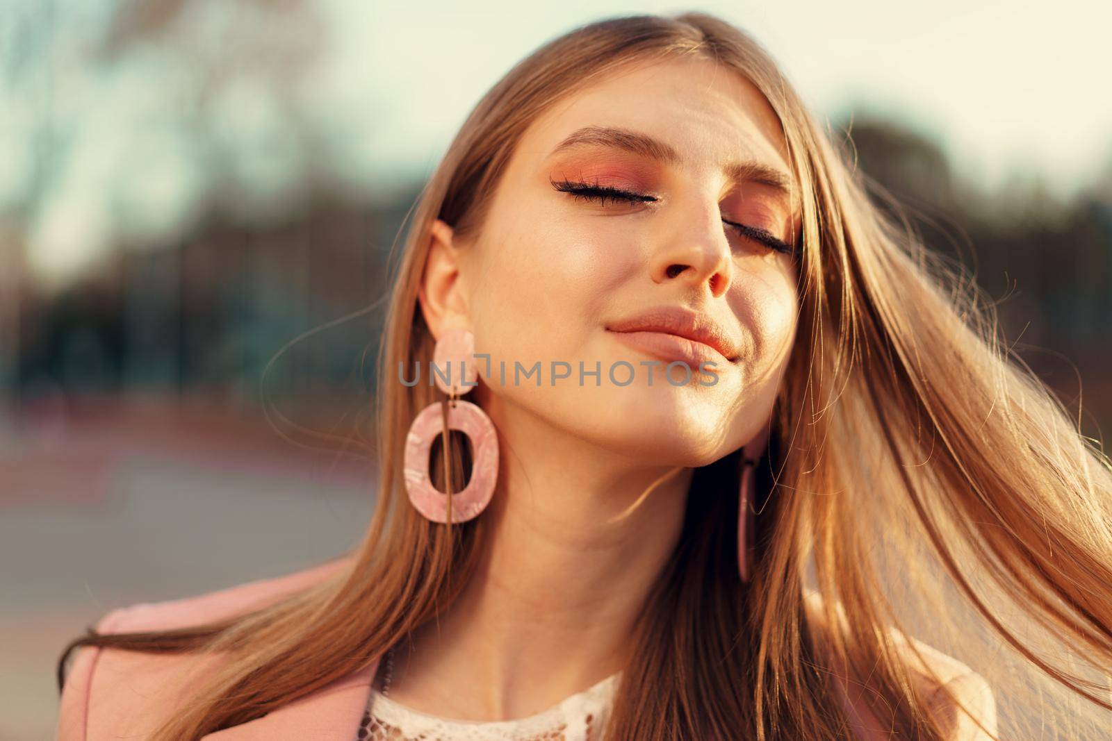 Close up portrait of a woman walking in the street. High quality photo