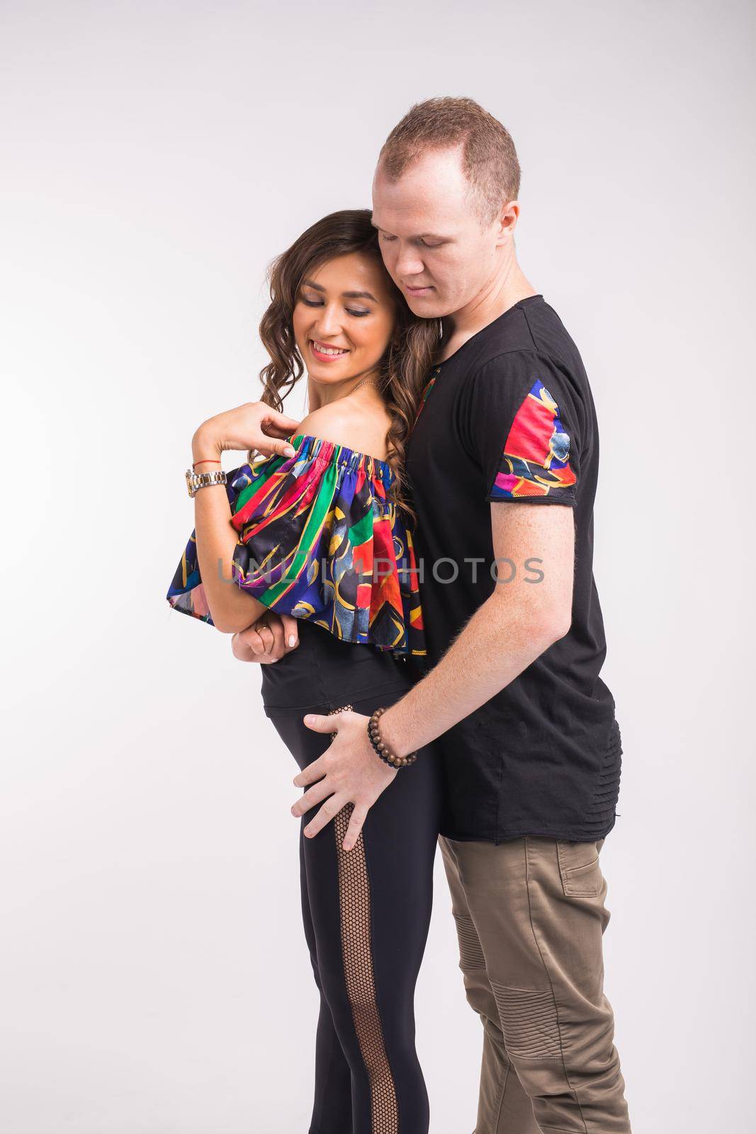 Funny couple dancing social dance. Kizomba or bachata or semba or taraxia , on white background. Social dance concept. by Satura86