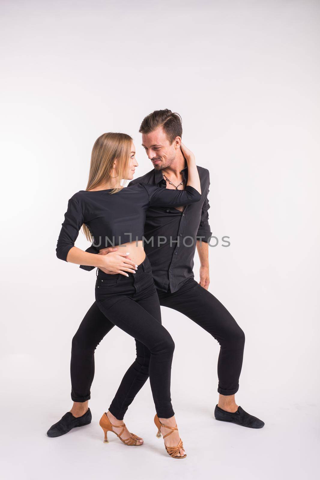 Salsa, kizomba and bachata dancers on white background. Social dance concept. by Satura86