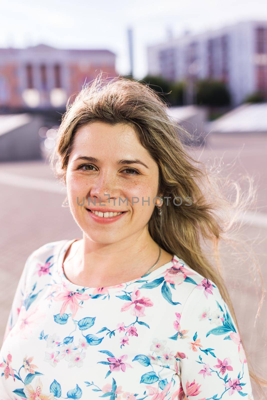 Portrait of a beautiful young caucasian blonde cheerful girl outdoor. Summer and vacation.