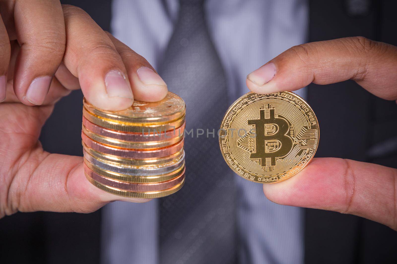 bitcoin in hand of business man with suit