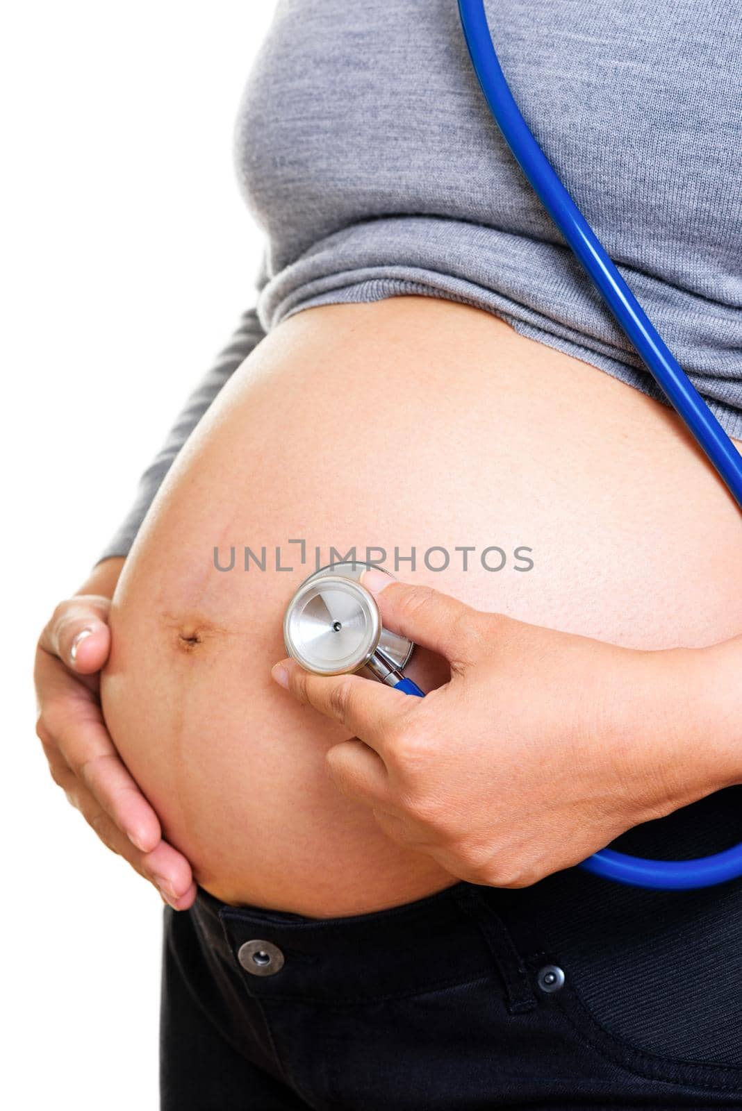 Pregnant woman being examine with stethoscope. Pregnancy concept