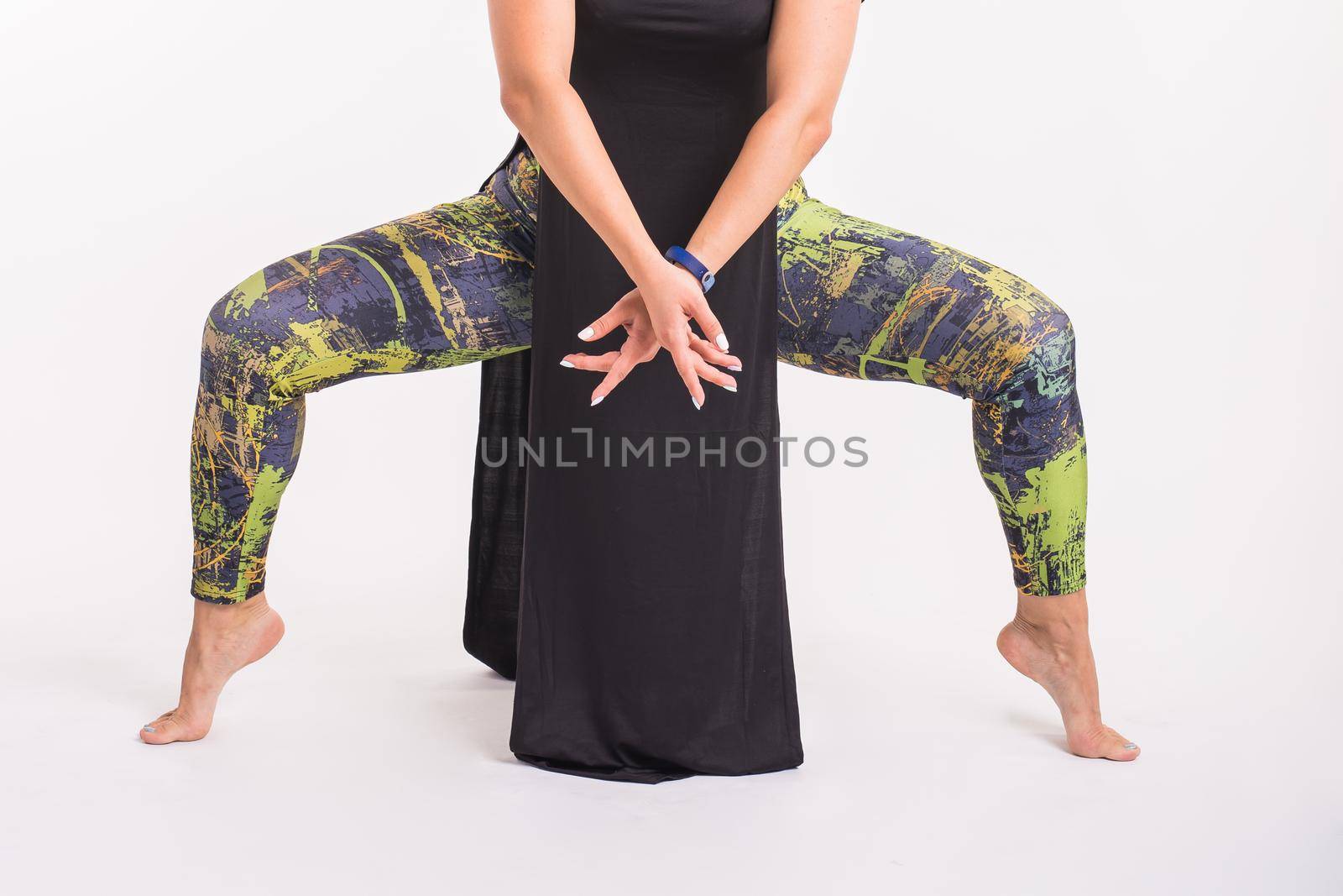 Latina dance, strip dance, contemporary and bachata lady concept - Woman dancing improvisation close-up on a white background. by Satura86