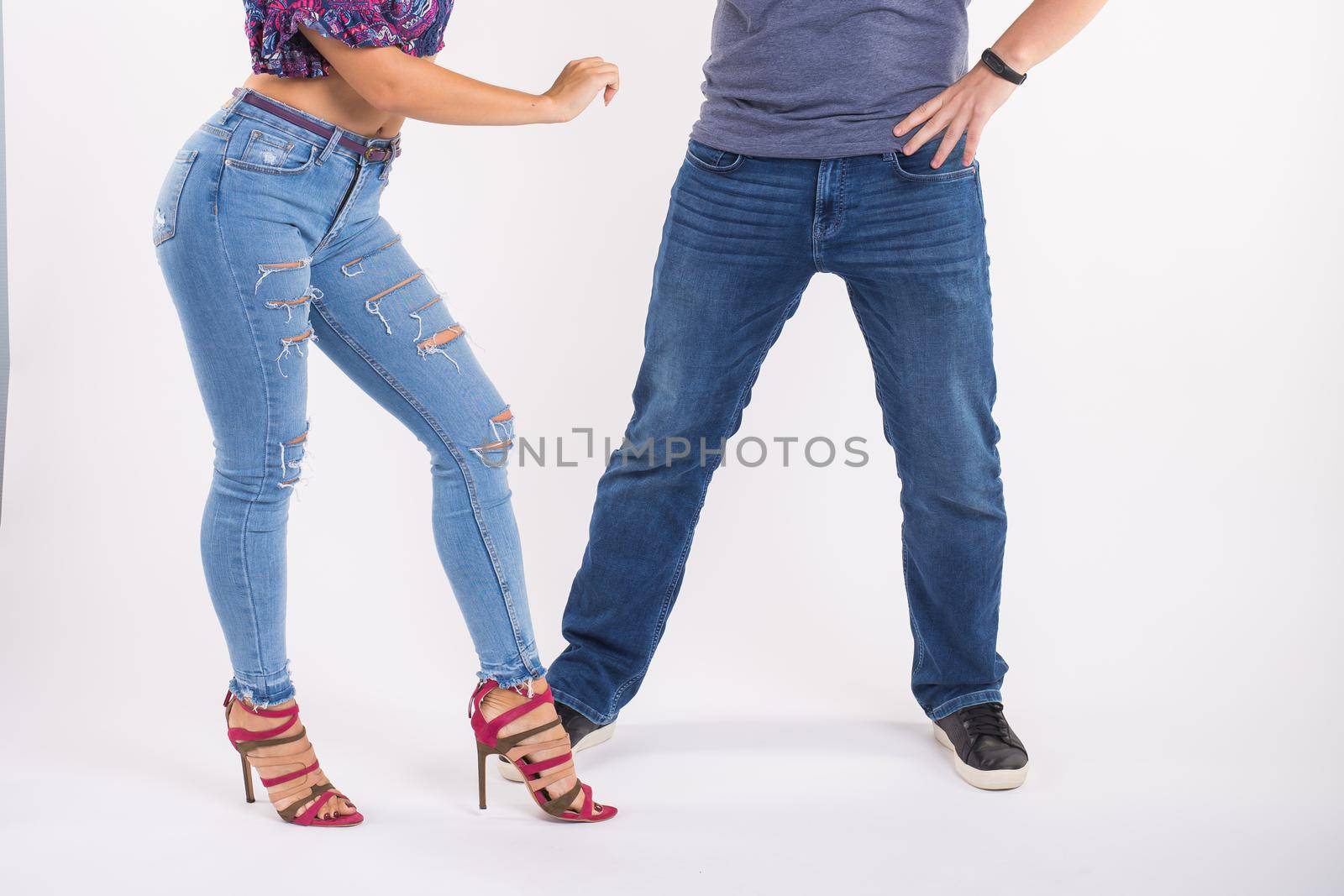Close-up of couple dancing social dance. Kizomba or bachata or semba or taraxia , on white background. Social dance concept. by Satura86