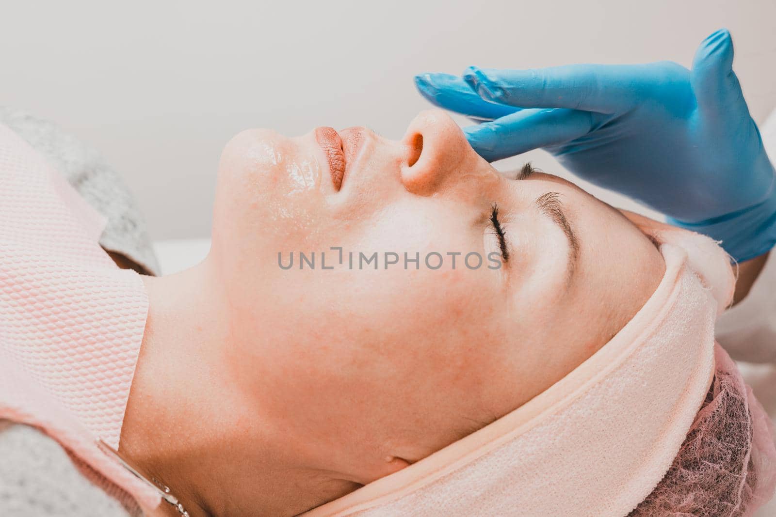 Steaming the face to open pores, applying liquid cream to open pores. by Niko_Cingaryuk