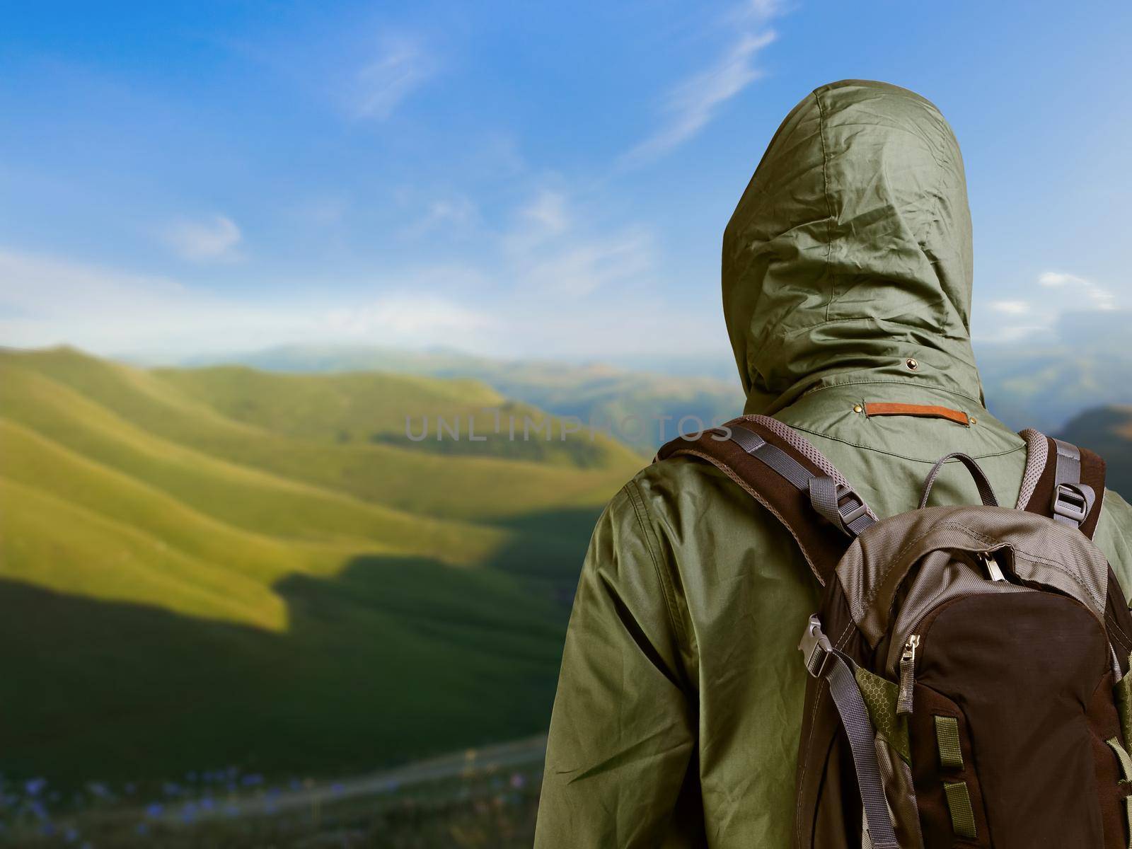 Hiker man enjoying view at nature with backpack.
