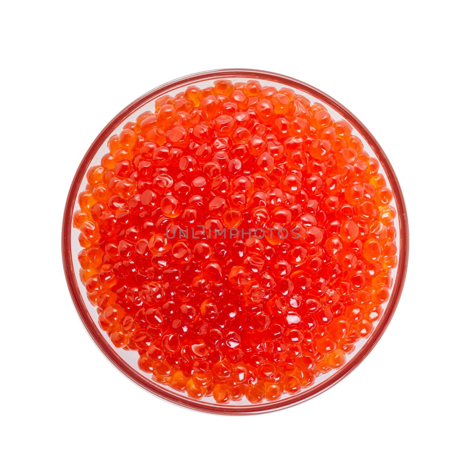 Red caviar in a bowl on a white background, top view