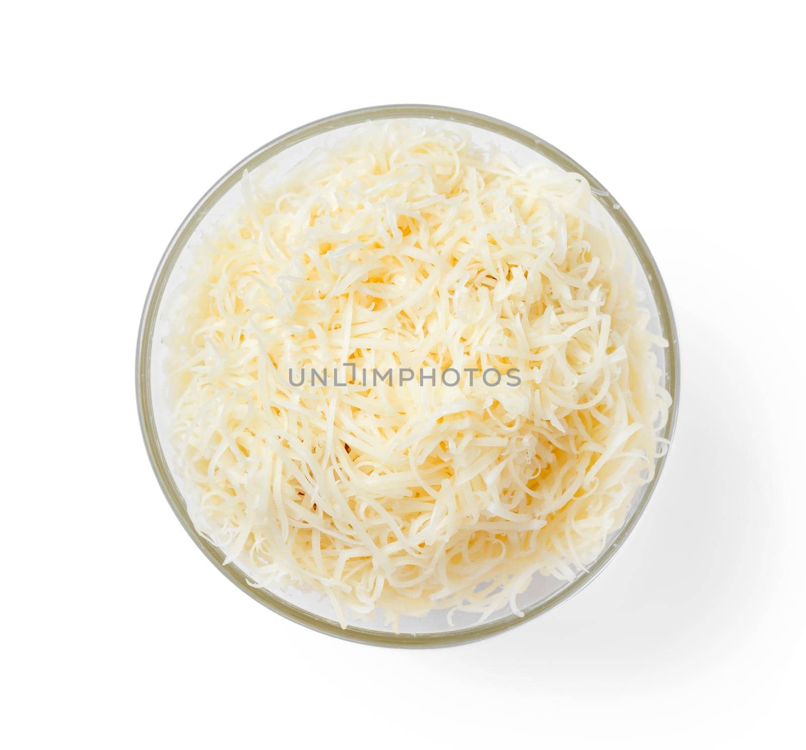 Bowl with grated cheese on a white background, top view.