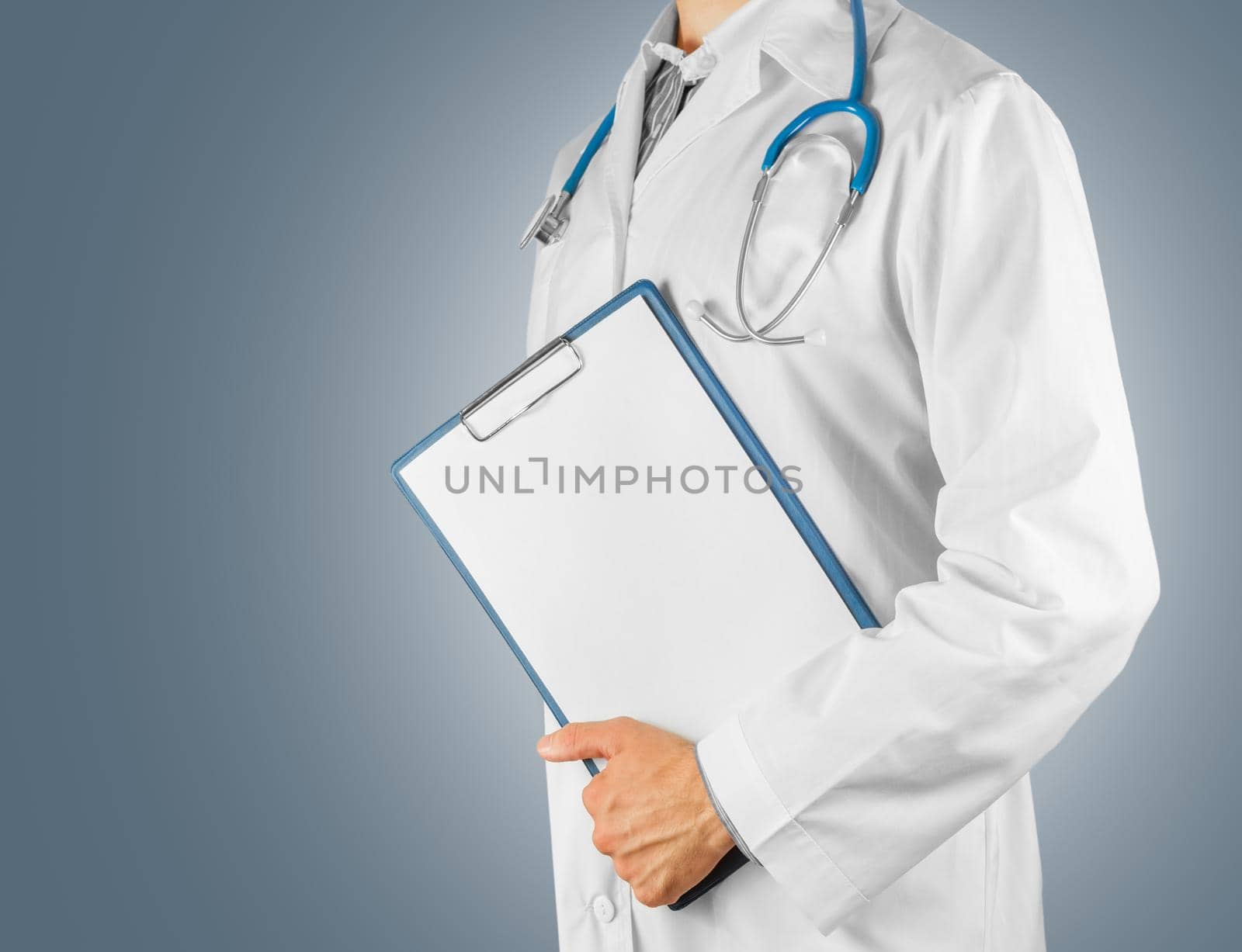 Unrecognizable man doctor holding a clipboard, copyspace
