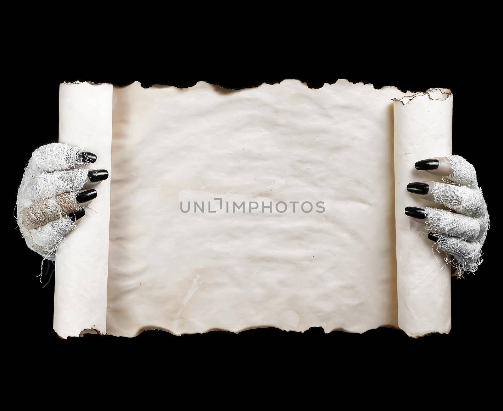 Hands of mummy holding horizontal scroll on dark background. Space for text.