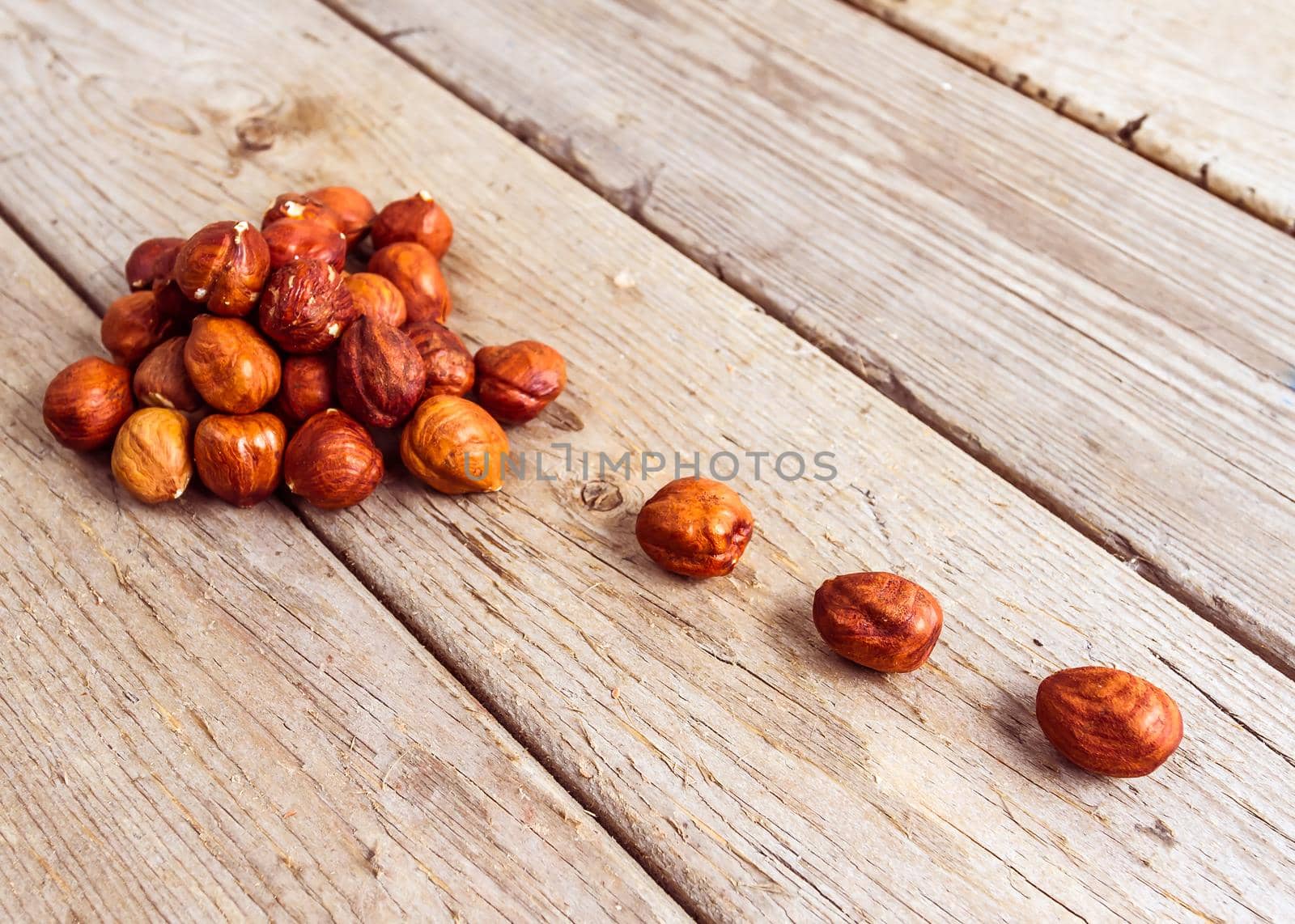 Stack nuts fruit on wood background texture