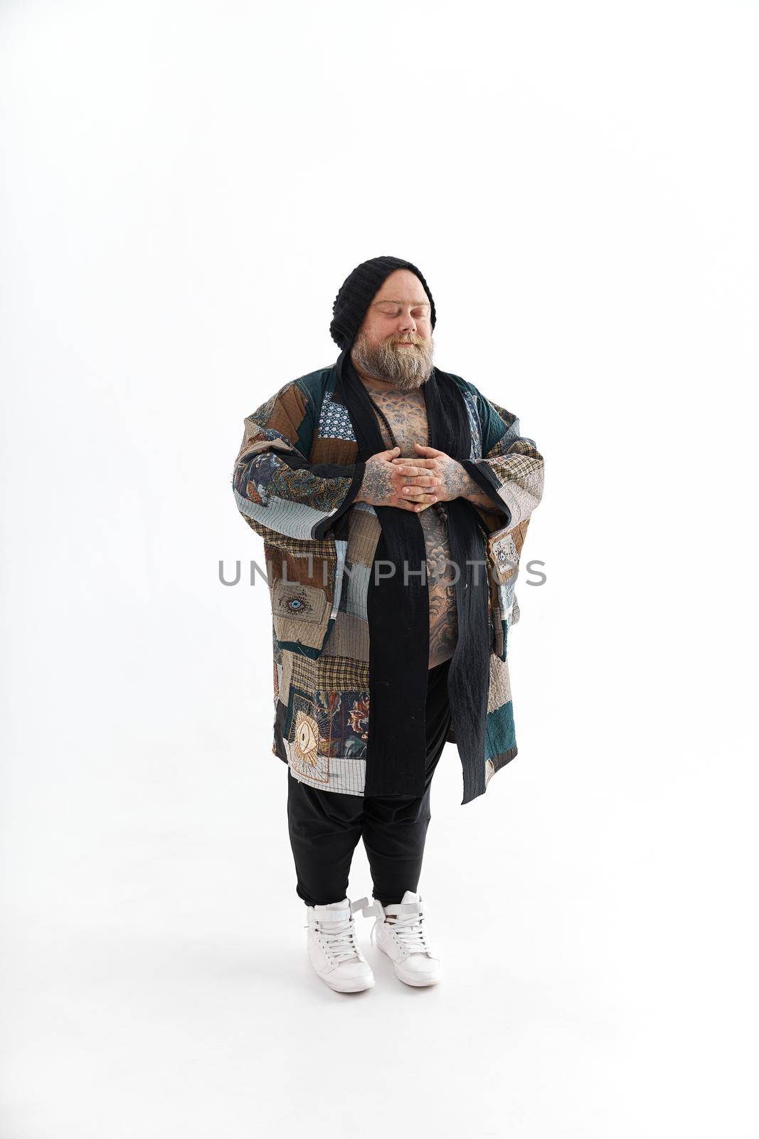 Fat stylish bearded tattoed caucasian man with big belly is posing and dancing wearing ethnic kimono by Yaroslav_astakhov