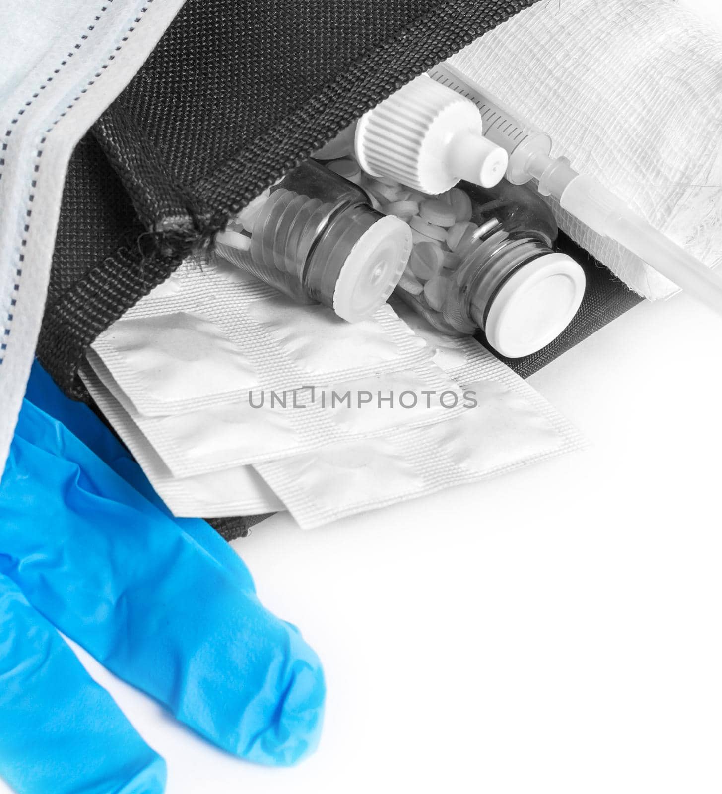 Medication, syringe, bandages, gloves, mask close-up