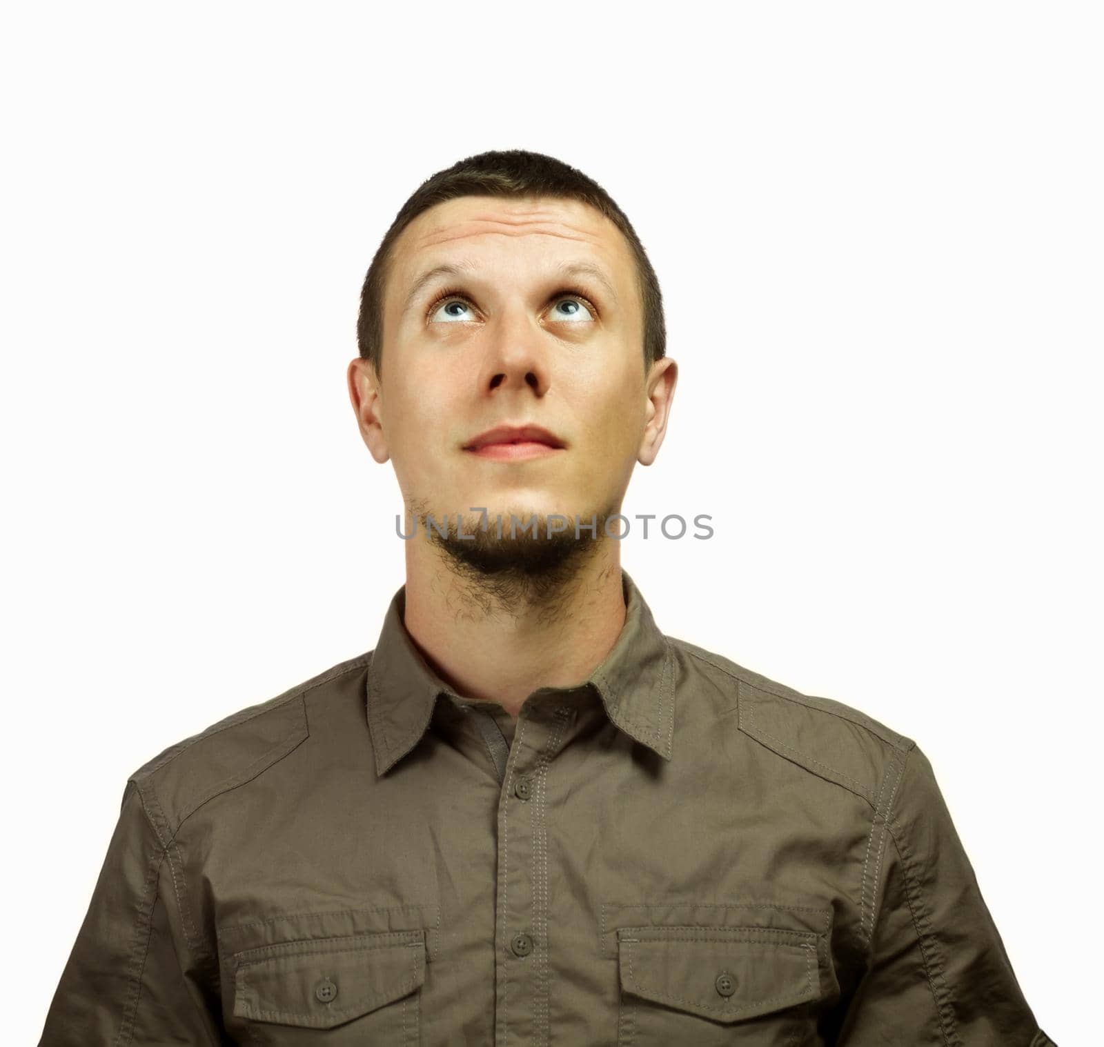 Young man looking up, space for text