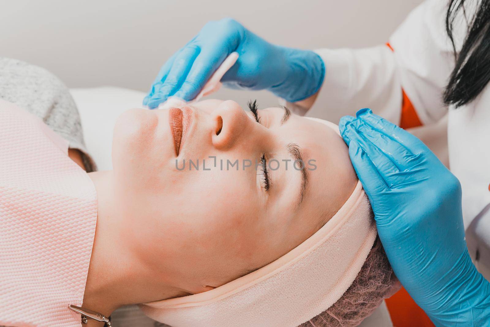 Washing the face before the ultrasonic cleansing procedure, the procedure of recovery and freshness of the facial skin. new