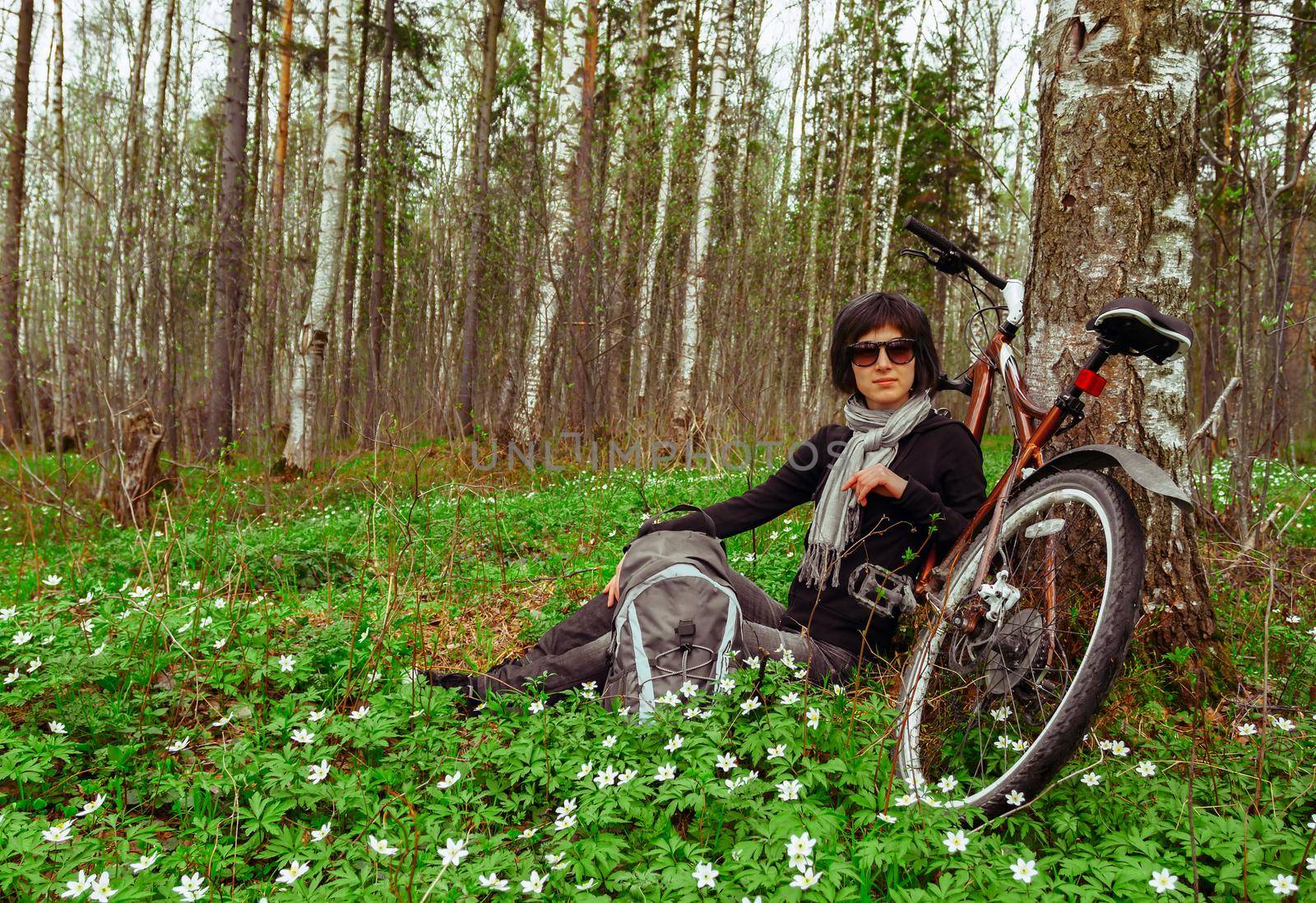 Cyclist resting in a tree