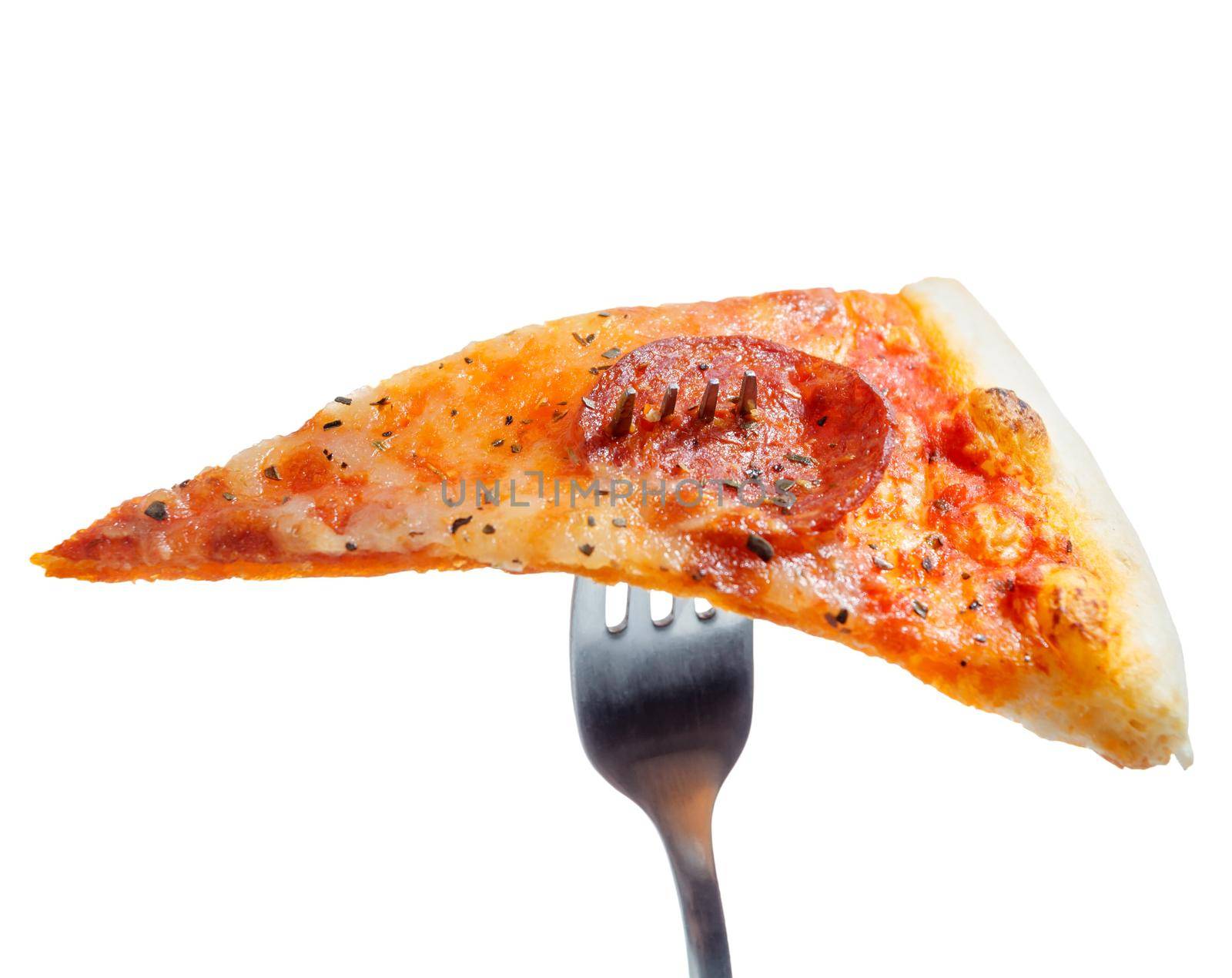 Slice of pizza on a fork on a white background