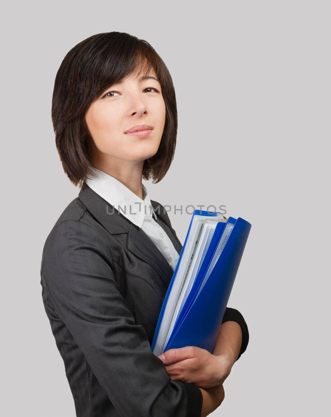 Young business woman holds folders with documents, space for text