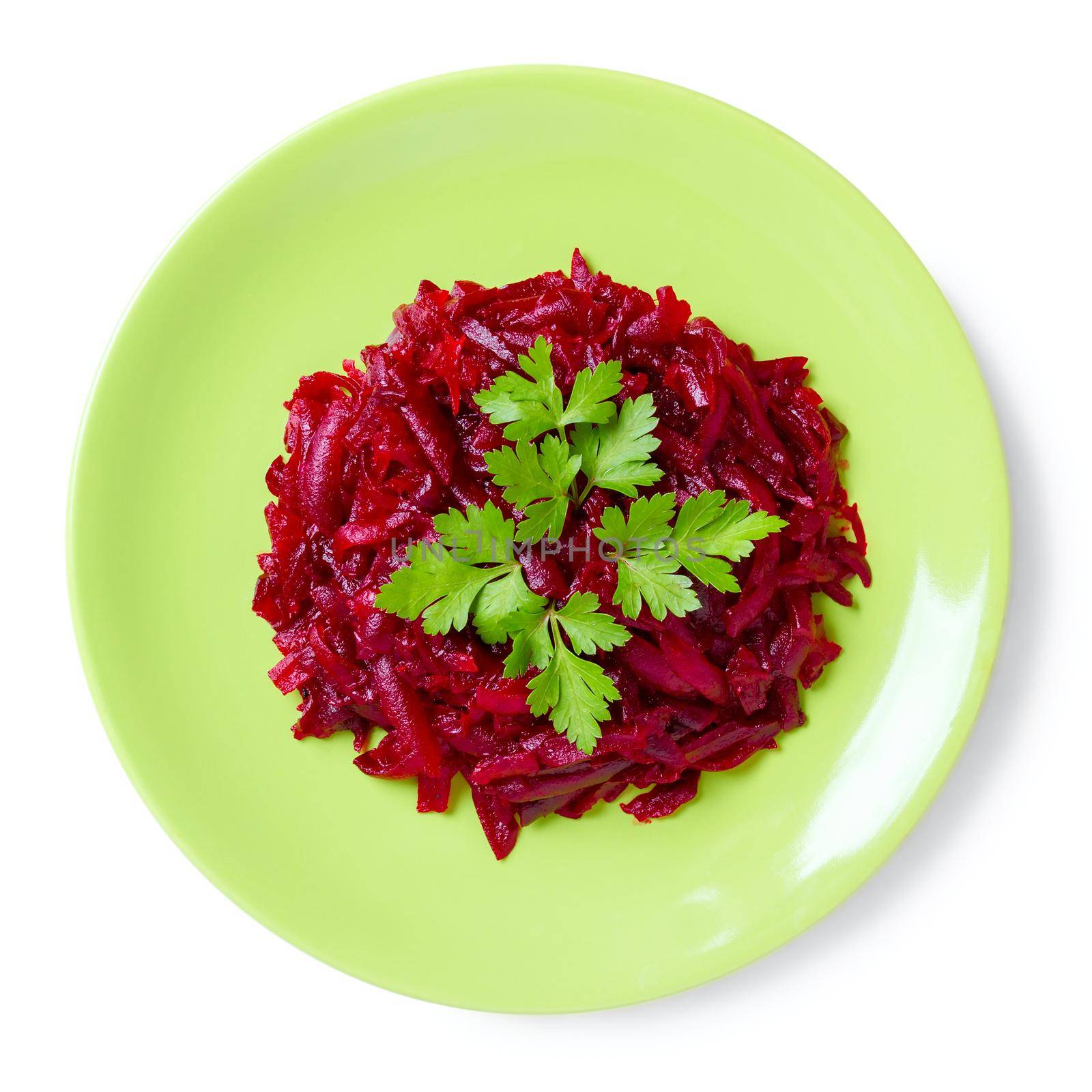 Beet salad on a green plate, top view.