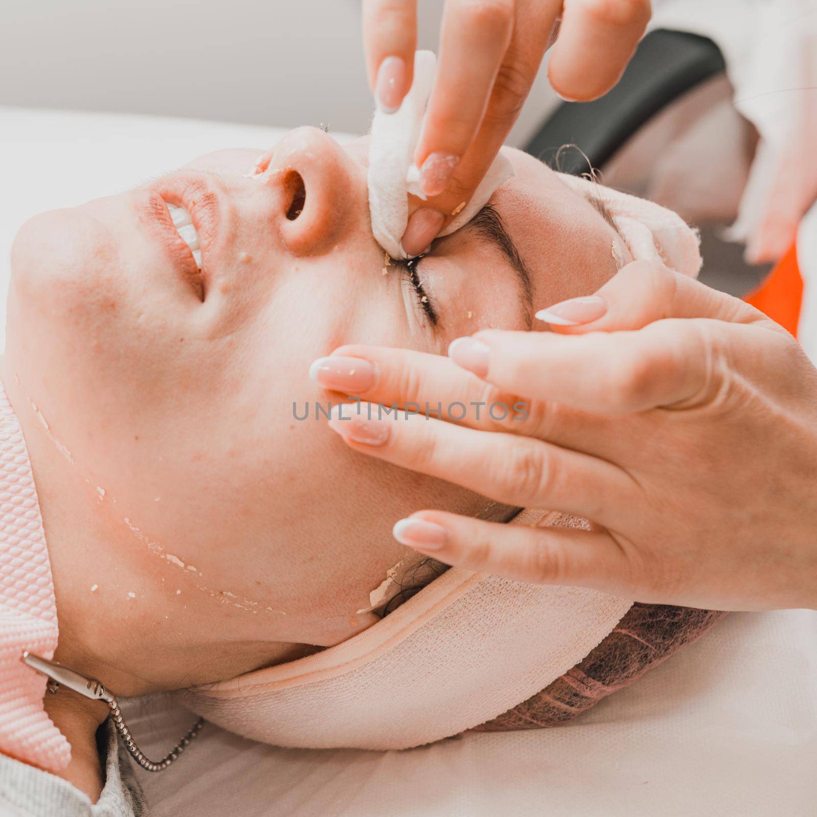 Facial massage at the beautician at the reception, visiting a beauty salon, a sense of relaxation. new