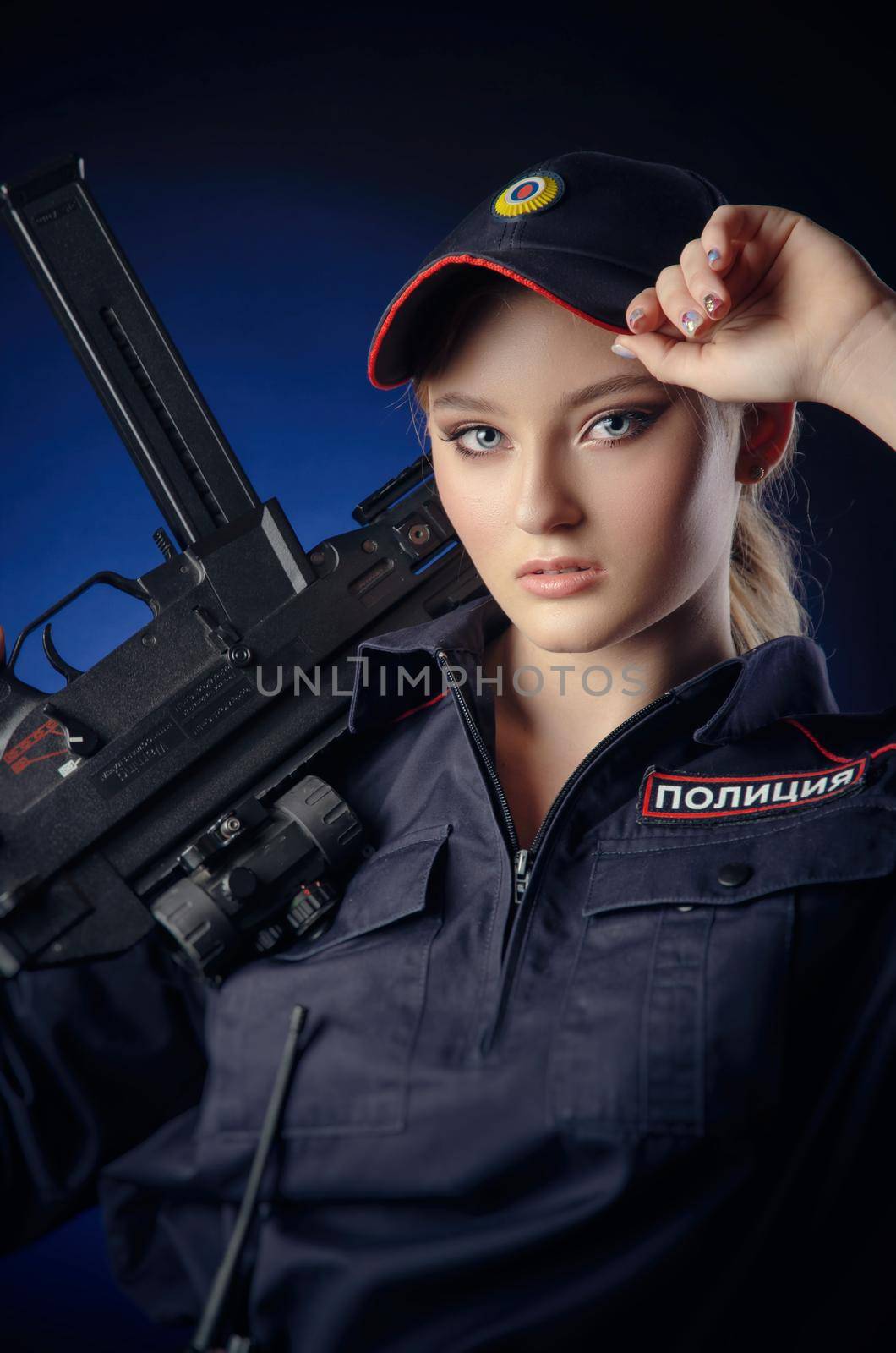 the girl in the police uniform with a gun is a Russian policeman with gun. English translation of Police by Rotozey