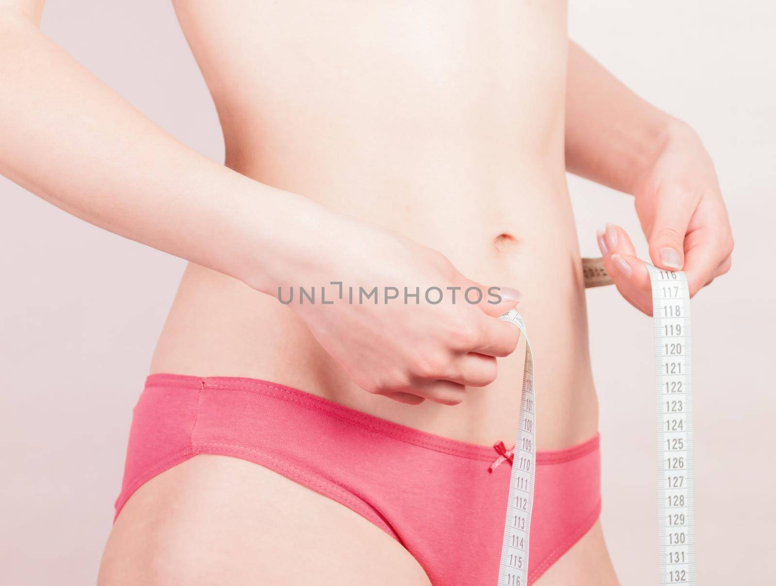 young woman measuring body