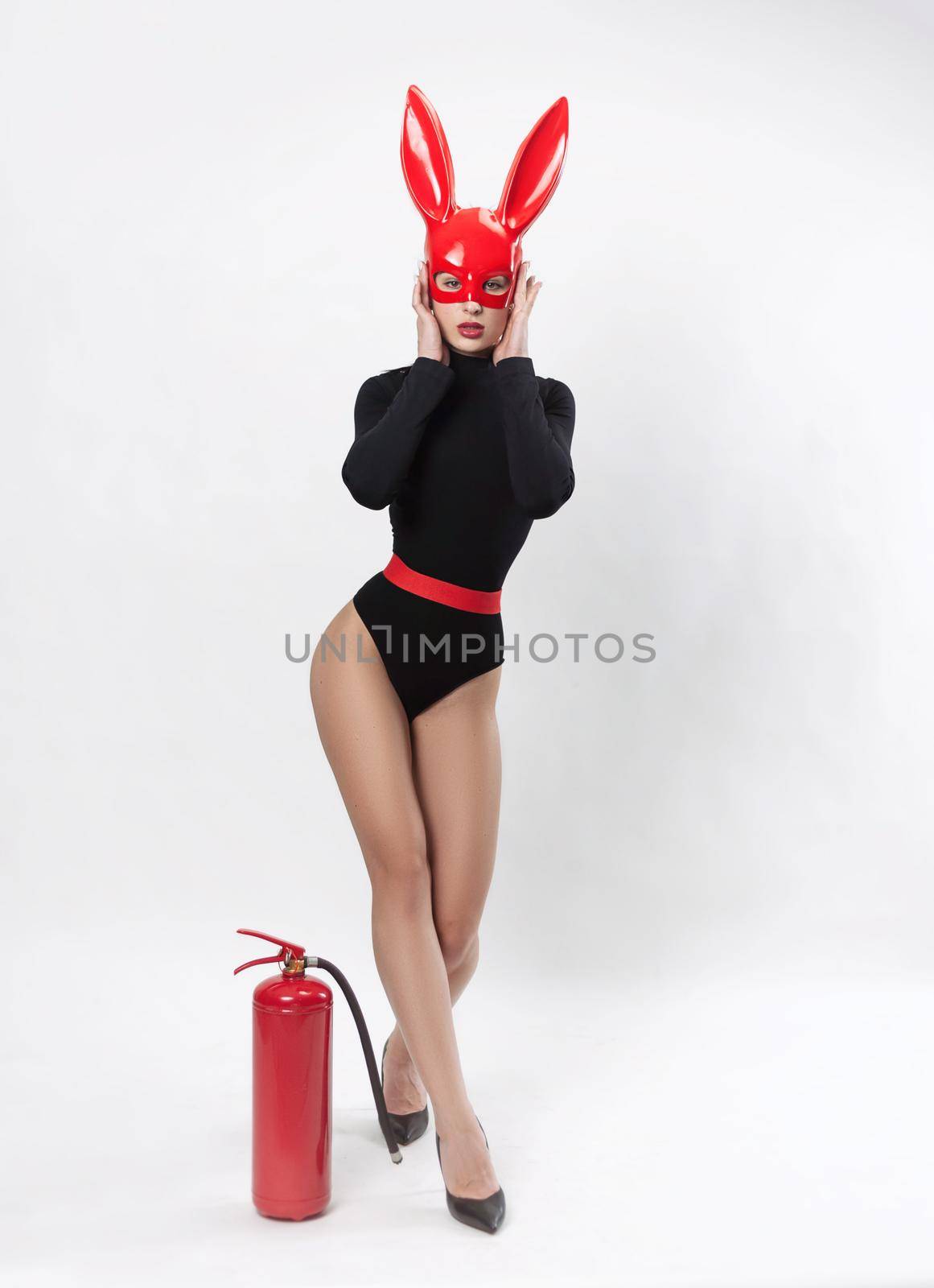 the woman in red rabbit mask and black bodysuit on white background