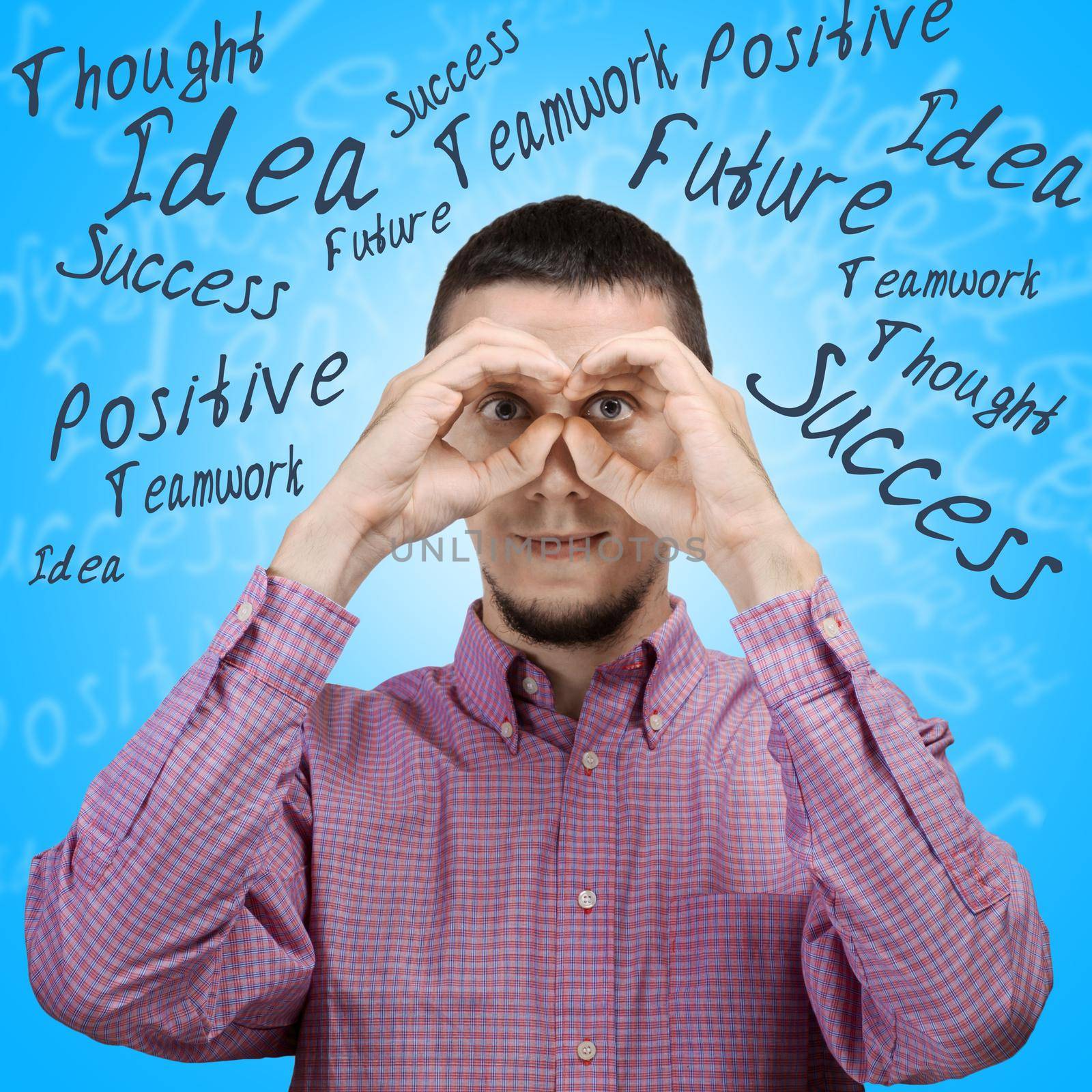 Young man is looking to the future making binoculars with his hands, concept