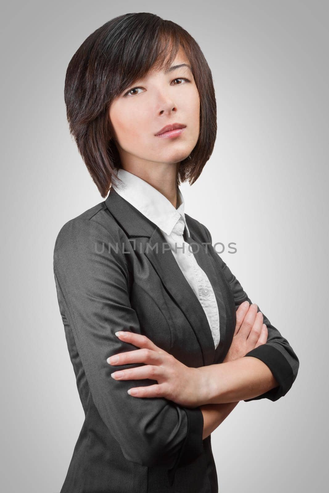 Portrait of a young businesswoman in a gray suit