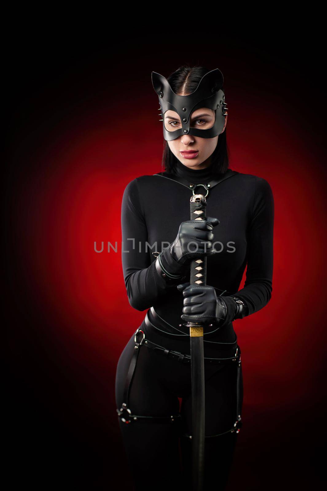 a woman in a black body belt and cat mask by Rotozey