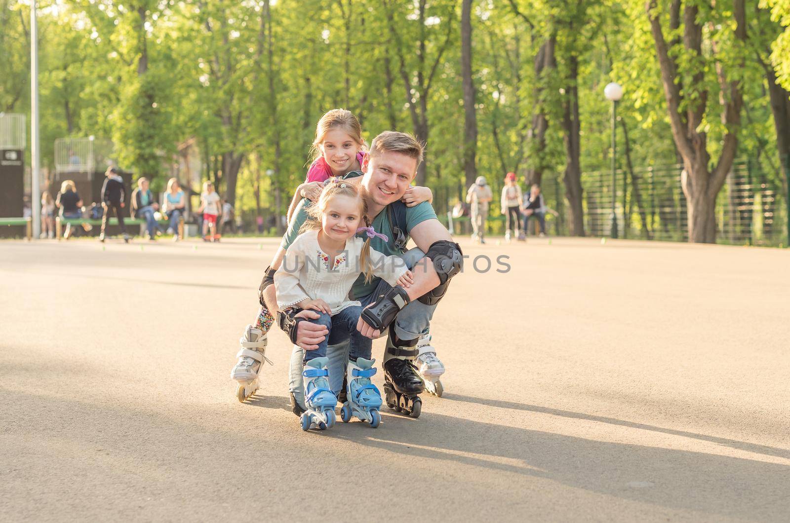 sisters and their father posing and roller skating by tan4ikk1