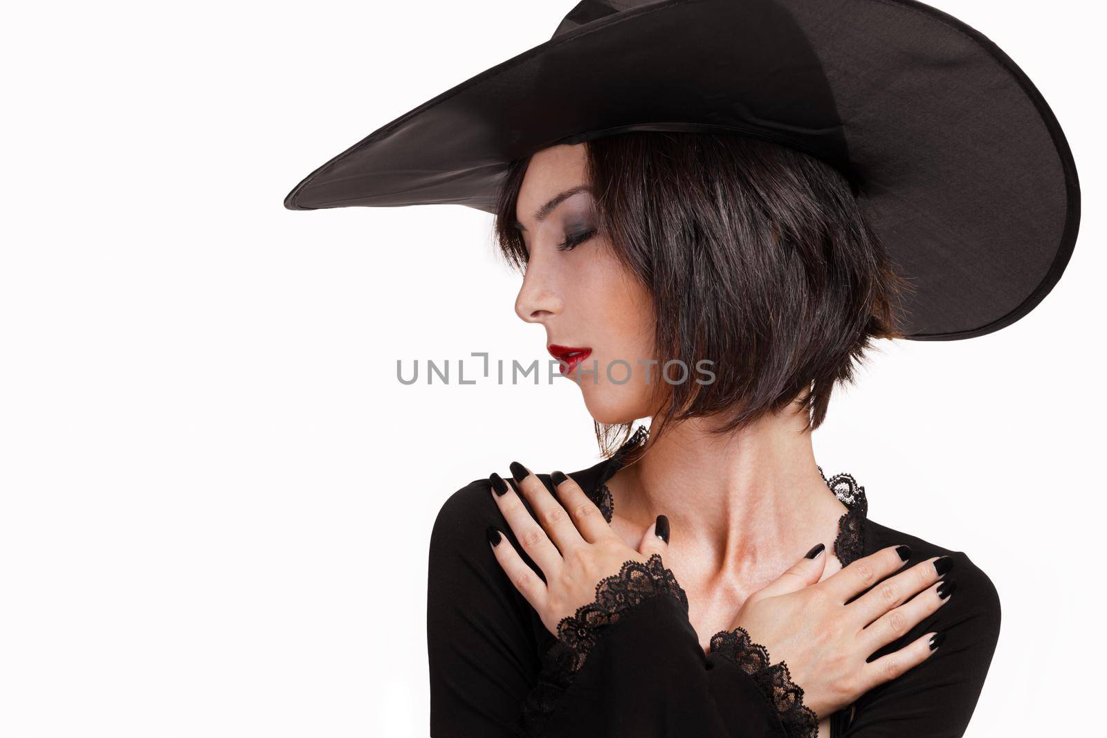 Halloween witch with arms crossed on the chest